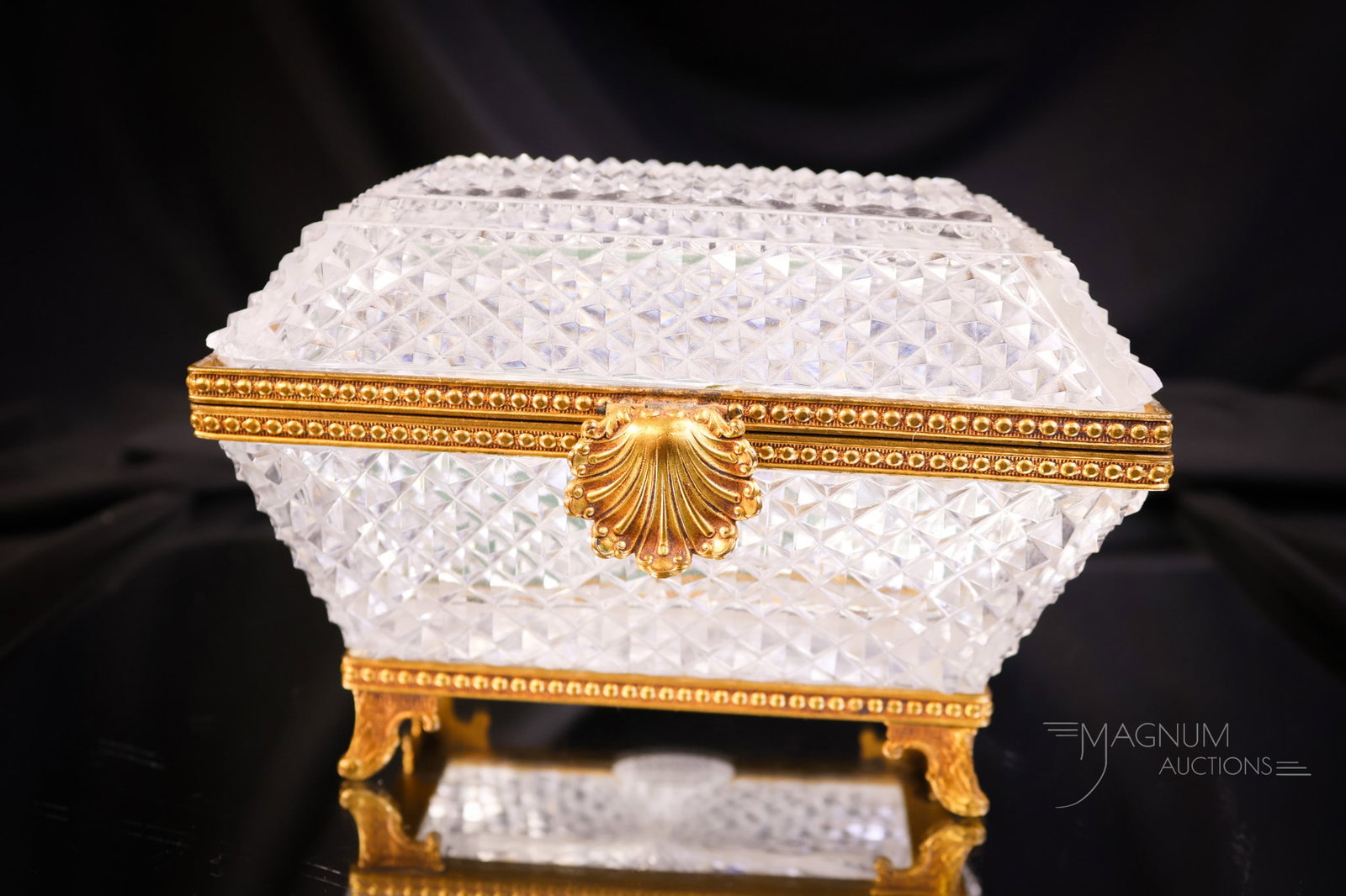 French Cut Crystal Regency Gilt Ormolu Mounts Jewelry Casket: Another gorgeous find in a French Regency-style cut-crystal jewelry casket. This one features gilt ormolu mounts and a clasp to open. The casket measures 4" tall and 6" wide. SHIPPING NOTICE: If you c