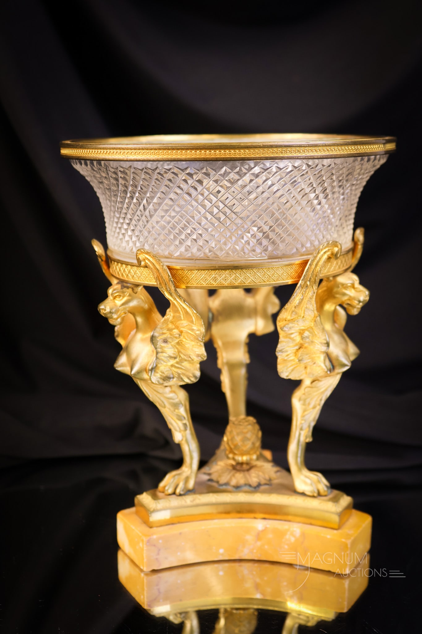 French Gilded Bronze & Cut Crystal Mythical Beasts Marble Centerpiece: A French gilded bronze and cut crystal centerpiece. This piece features figural mythical beasts for the supports and has a marble base. The centerpiece measures 7 3/4" tall and 6" wide. SHIPPING NOTIC