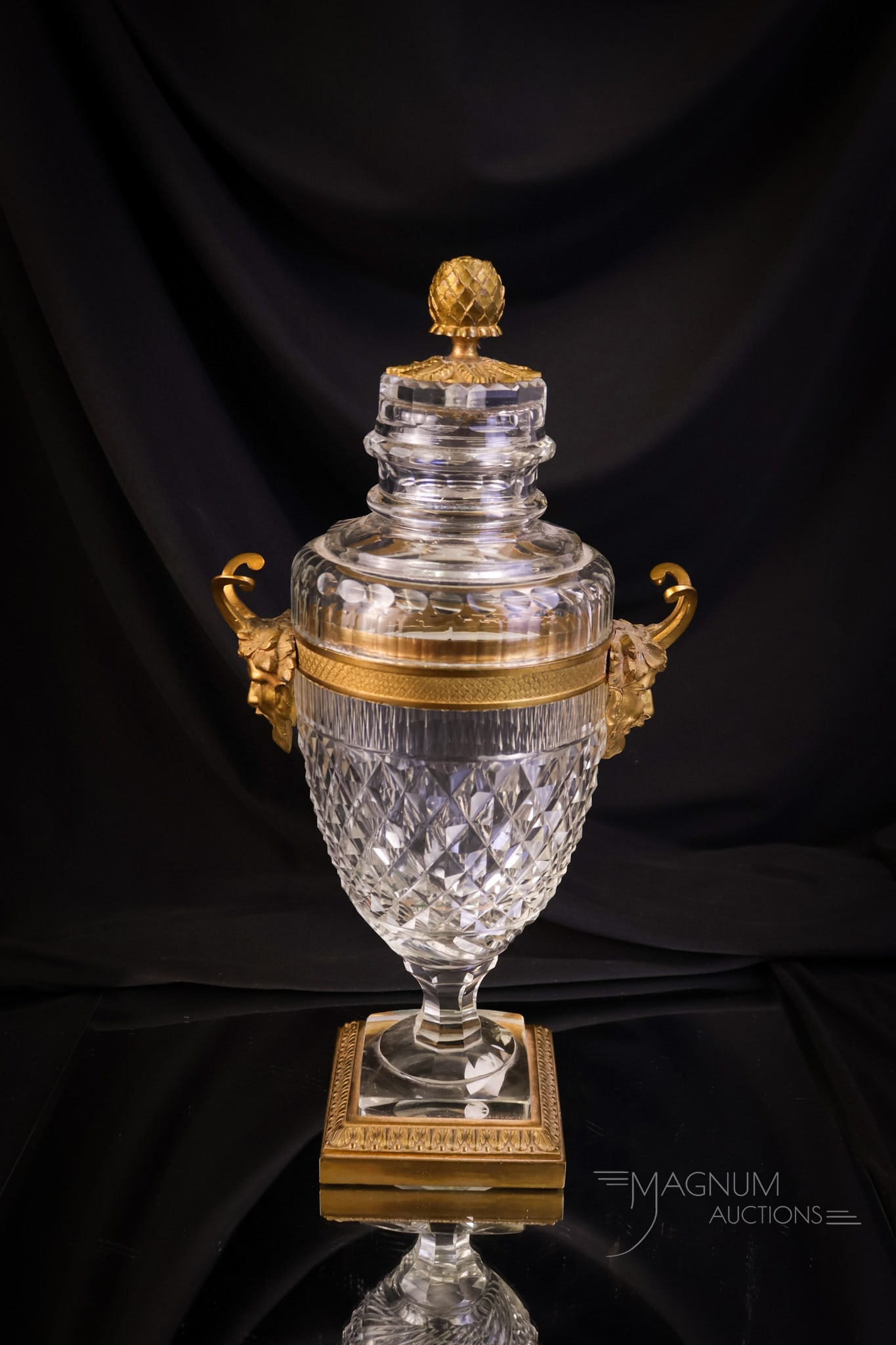 French Cut Crystal Gilt Bronze Satyr 12" Urn: An estate fresh find. This is a French cut crystal urn. This piece features gilt bronze mounts, including Satyr heads and a flower bulb finial. This 12" tall urn is 6" wide. Lovely! SHIPPING NOTICE: I