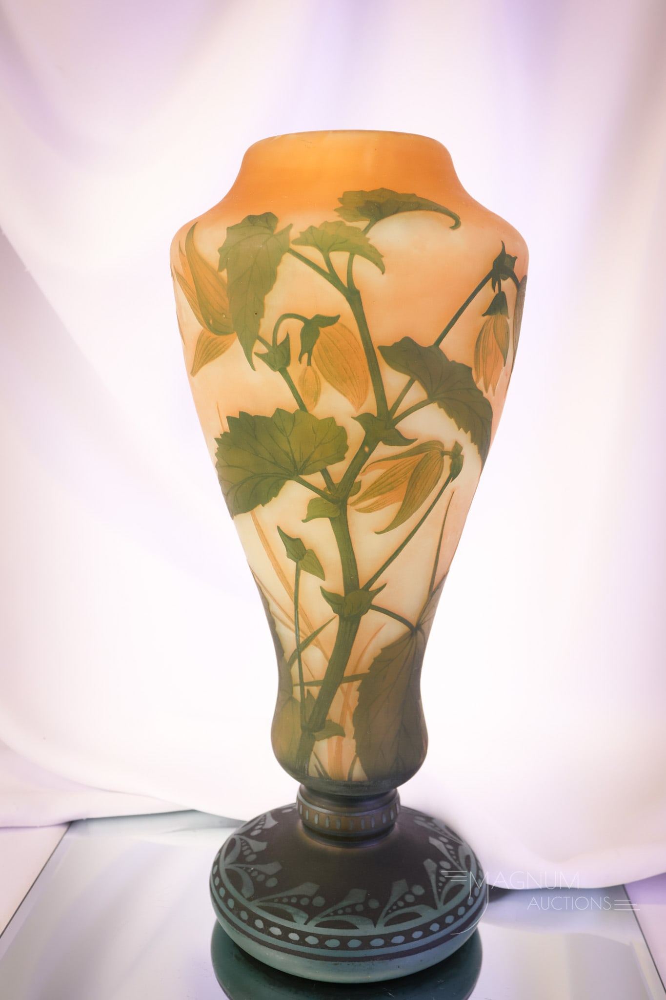 Signed Daum Nancy French Cameo Art Glass 15 1/4" Vase: Another impressive piece in our lineup of collectible art glass. This is a 15 1/4" tall signed Daum Nancy cameo glass vase. The vase features colors of orange and muted green with a floral motif. Love