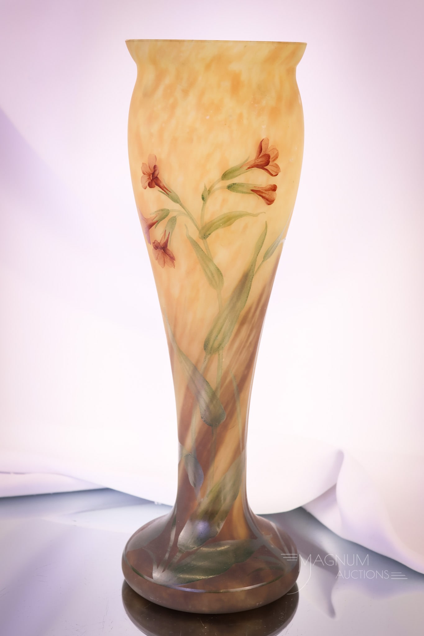 Signed "Mado Nancy" Enameled Mottled Art Glass 12 3/4" Vase: A fine mottled glass vase enameled with a floral pattern. This vase is signed "Mado Nancy." The vase measures 12 3/4" tall and 3 3/4" wide. SHIPPING NOTICE: If you choose not to utilize the LiveAuctio