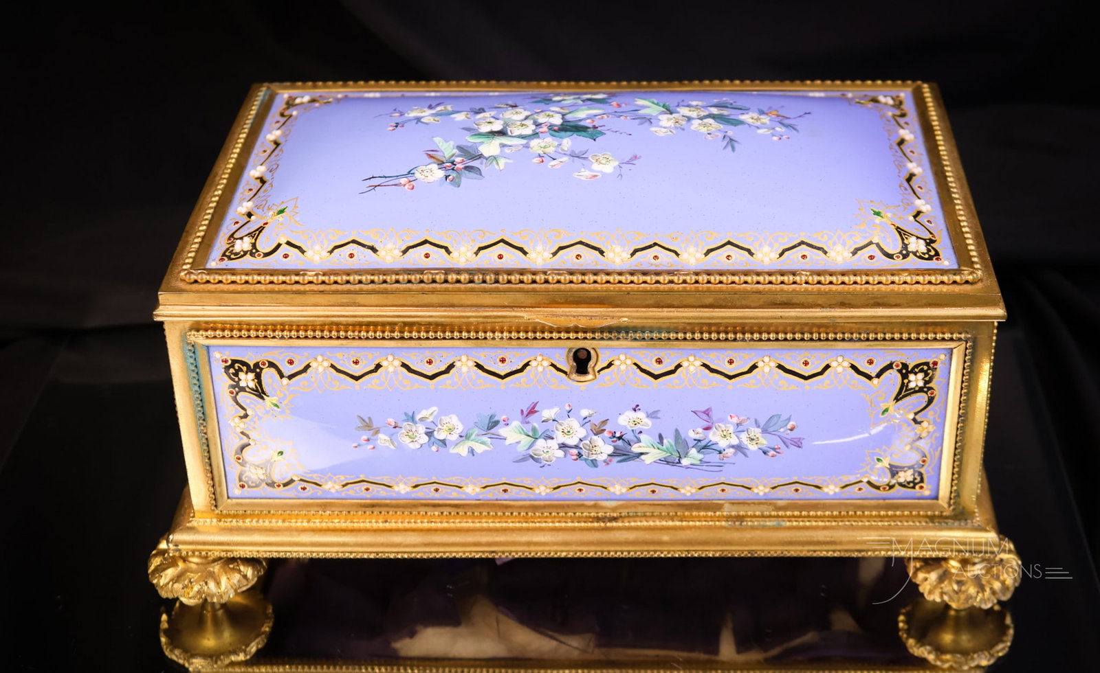 Large 19th Century Enamel on Copper Jeweled Tufted Gilt Bronze Jewelry Casket: A fabulous piece of artistry. This is a large 19th-century gilt bronze jewelry casket. The piece features raised enamel on copper panels in a periwinkle blue with florals. The casket is ornate but the