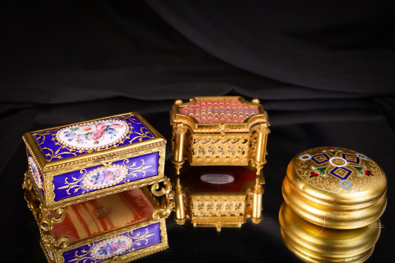 3 pc Lot Gilt Bronze & More Enameled Jewelry Casket Boxes: A sweet lot of three gilt bronze and enameled caskets and boxes. The first is a gilt bronze casket with a paper top and a silk lining. The second is a gilt bronze with enamel on copper panels. The thi