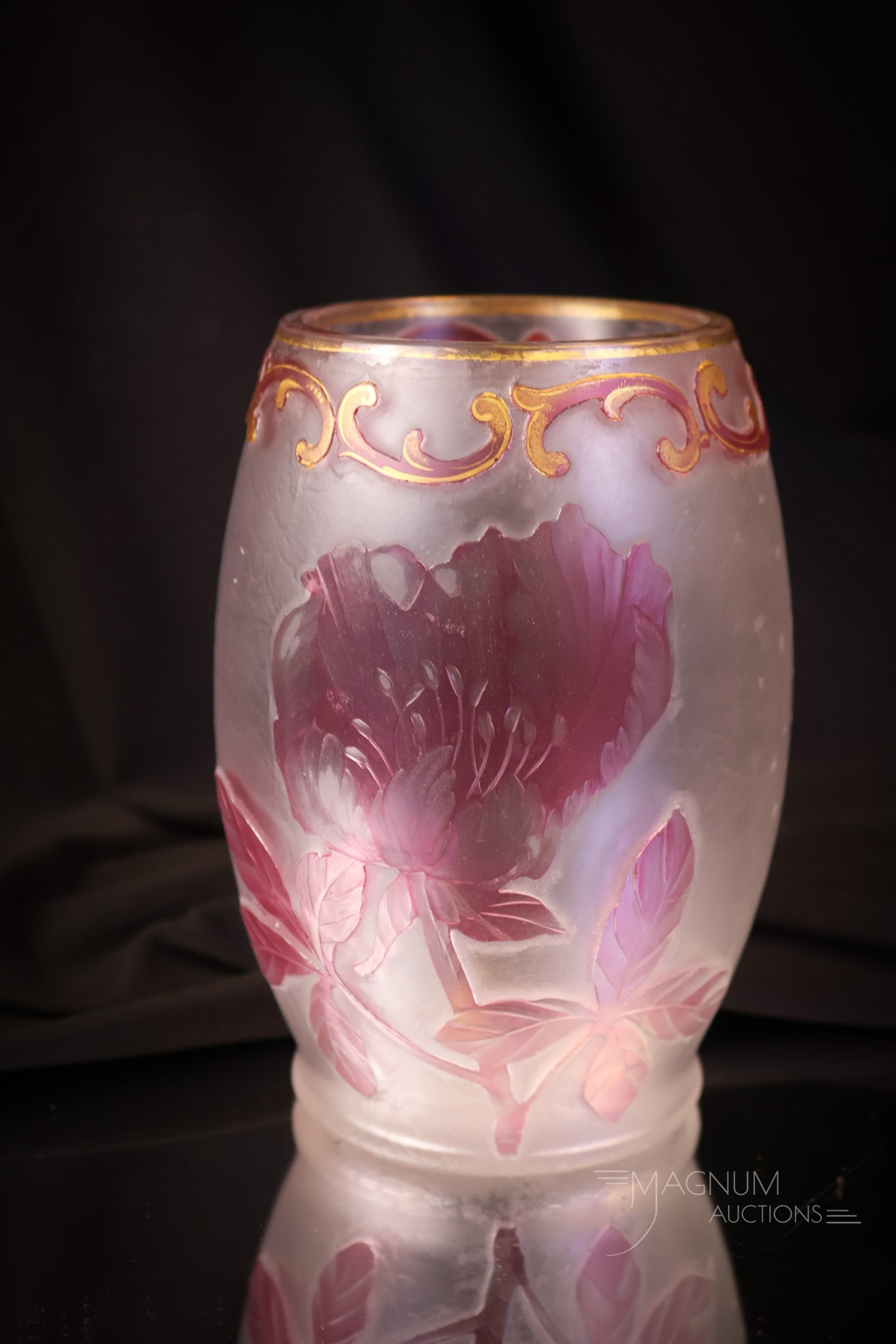 Attributed Harrach Cameo Art Glass Vase: A fine cameo art glass vase. This is attributed to Harrach glass. The vase is clear with cranberry-tinted flowers and foliage. The vase measures 5 1/4" tall and 3 3/4" wide. SHIPPING NOTICE: If you ch