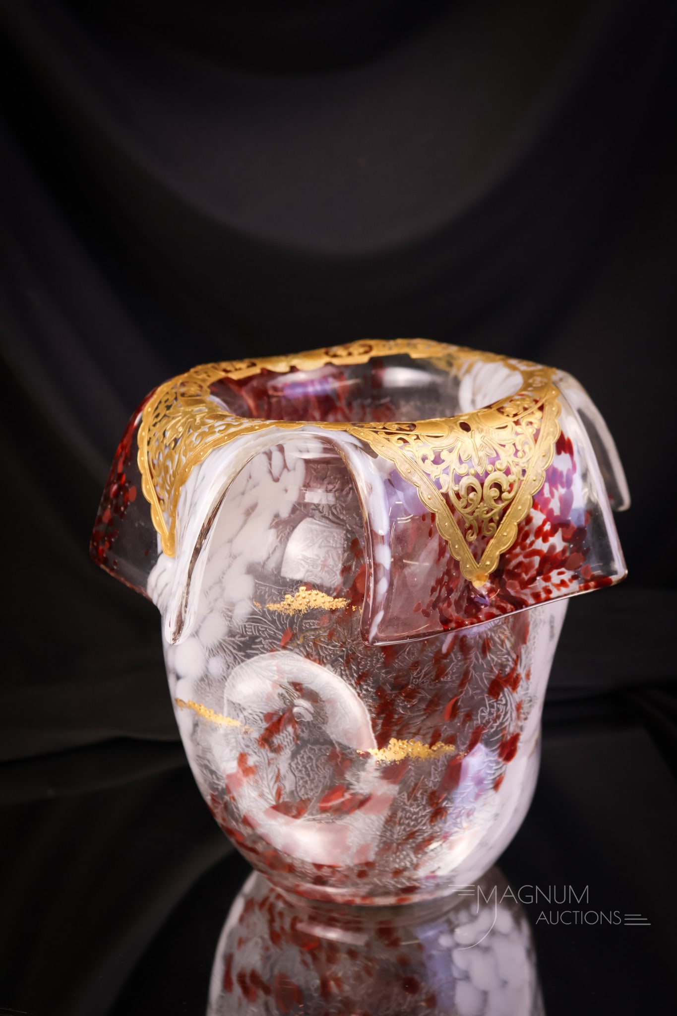 French Leveille Tortoise Spatter Quadrafoil Art Glass Vase: A lovely addition for your art glass collection. This is a French Leveille tortoise spatter art glass vase. The vase features a quadrafoil top with gold highlights. The vase measures 7 1/4" tall and 7
