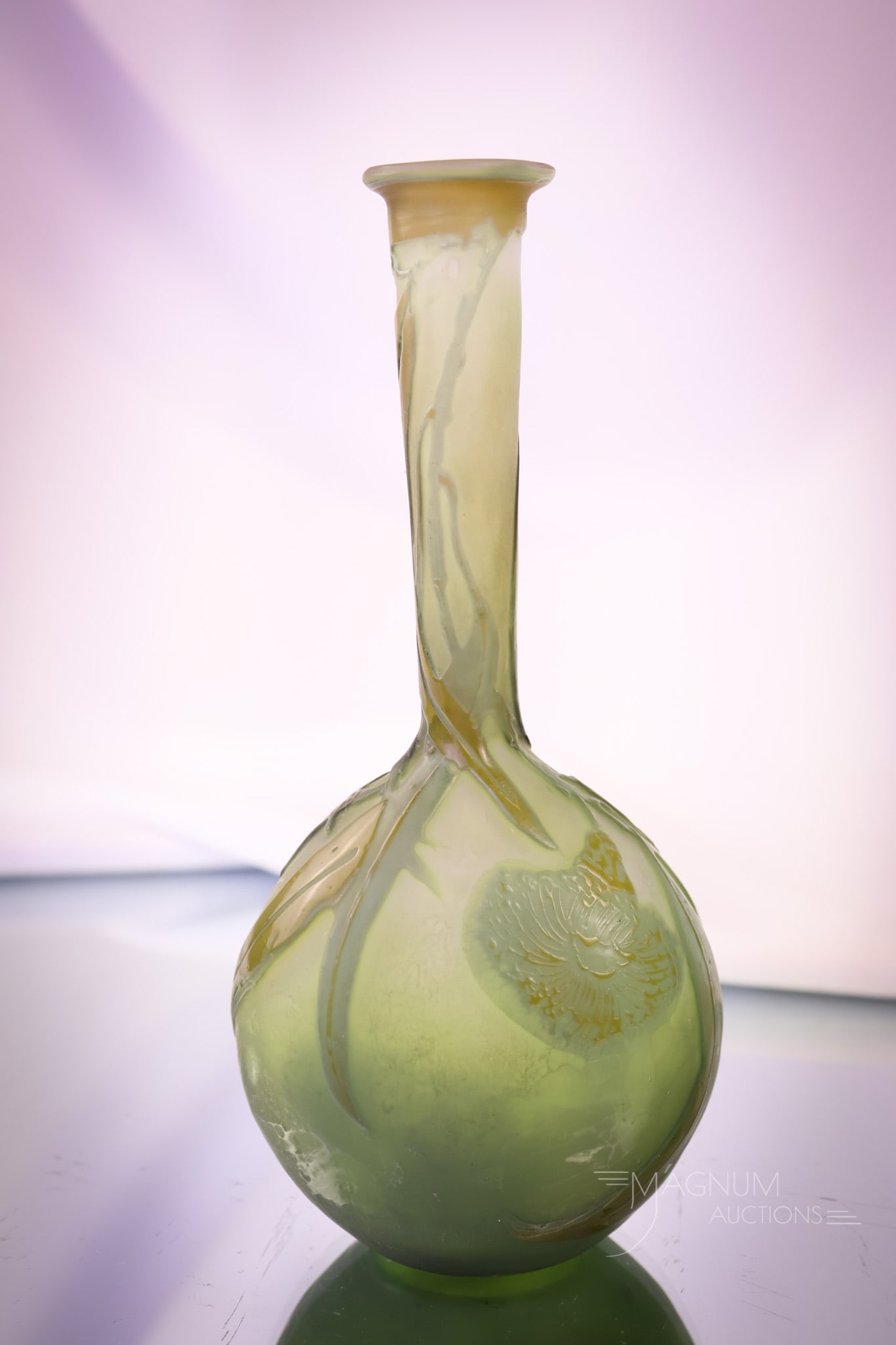 Signed Galle French Cameo Art Glass Banjo Vase: A beautiful find in a signed Galle French cameo art glass vase. This vase is in a banjo shape. It has stylized florals in dark green and brown colors. The vase measures 7" tall and 3" wide. SHIPPING N
