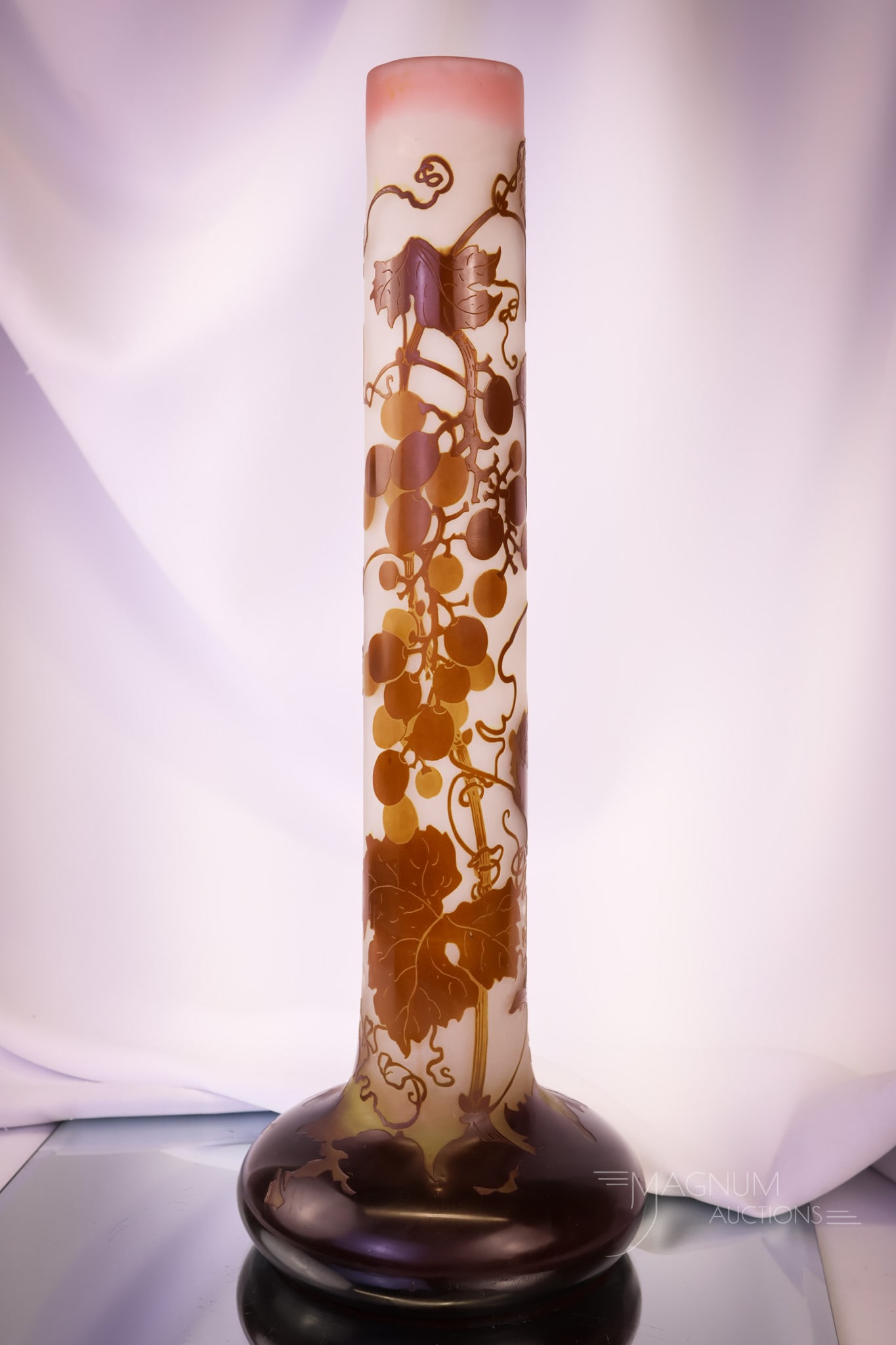 Signed galle 17 1/4" Franch Cameo Grape Art Glass Vase: A large and impressive find in signed Galle French cameo art glass. This vase measures 17 1/4" tall and 6" wide. It is decorated with grapes and grape leaves in shades of brown on a clear background. 