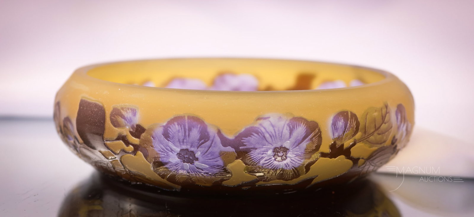 Signed Galle French Camneo Art Glass Low Bowl: A pretty find in Galle, signed French cameo art glass. This low bowl is decorated with cameo cut purple flowers with brown foliage against a fawn background. The bowl measures 1 1/2" tall and 6 1/4" w