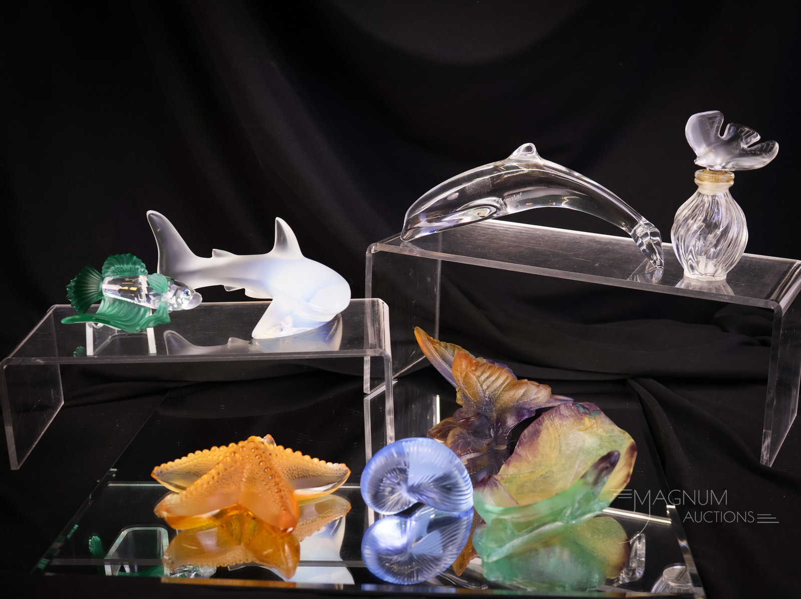 8 pc Lot French French Art Glass Figurines Daum Lalique Baccarat & Swarovski: A generous offering of eight figurines in French and more art glass. This lot includes a Lalique shark, dove, and starfish. There is a Daum Pate de Verre Butterfly and a lizard dish. A Baccarat dolphi