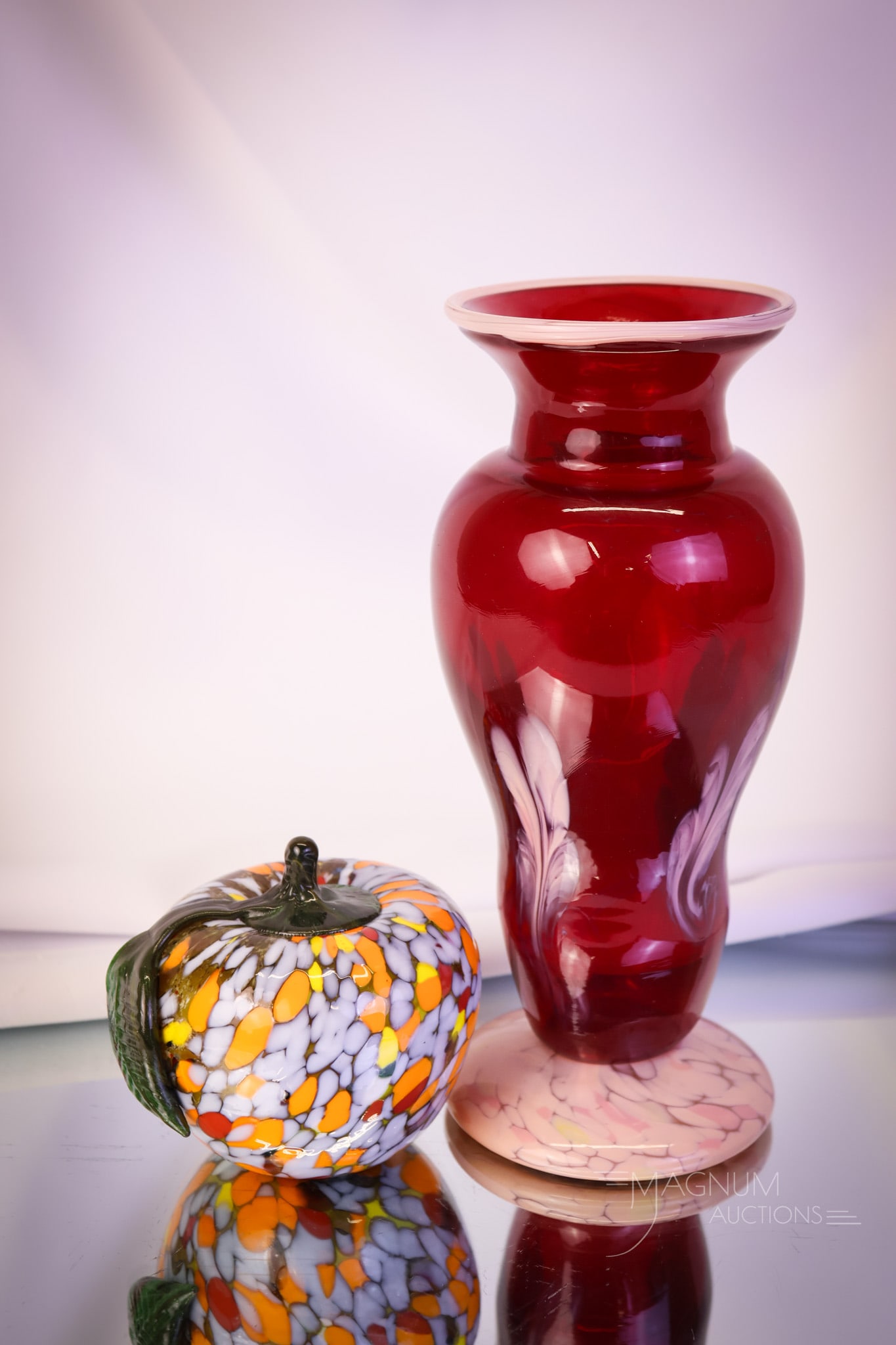 2 pc Lot Dave Fetty Art Glass: Another fine offering of two pieces of Dave Fetty glass. The first is an apple in multicolors of orange, yellow, and white with a green stem and leaf. It is signed Dave Fetty. The apple is signed and 