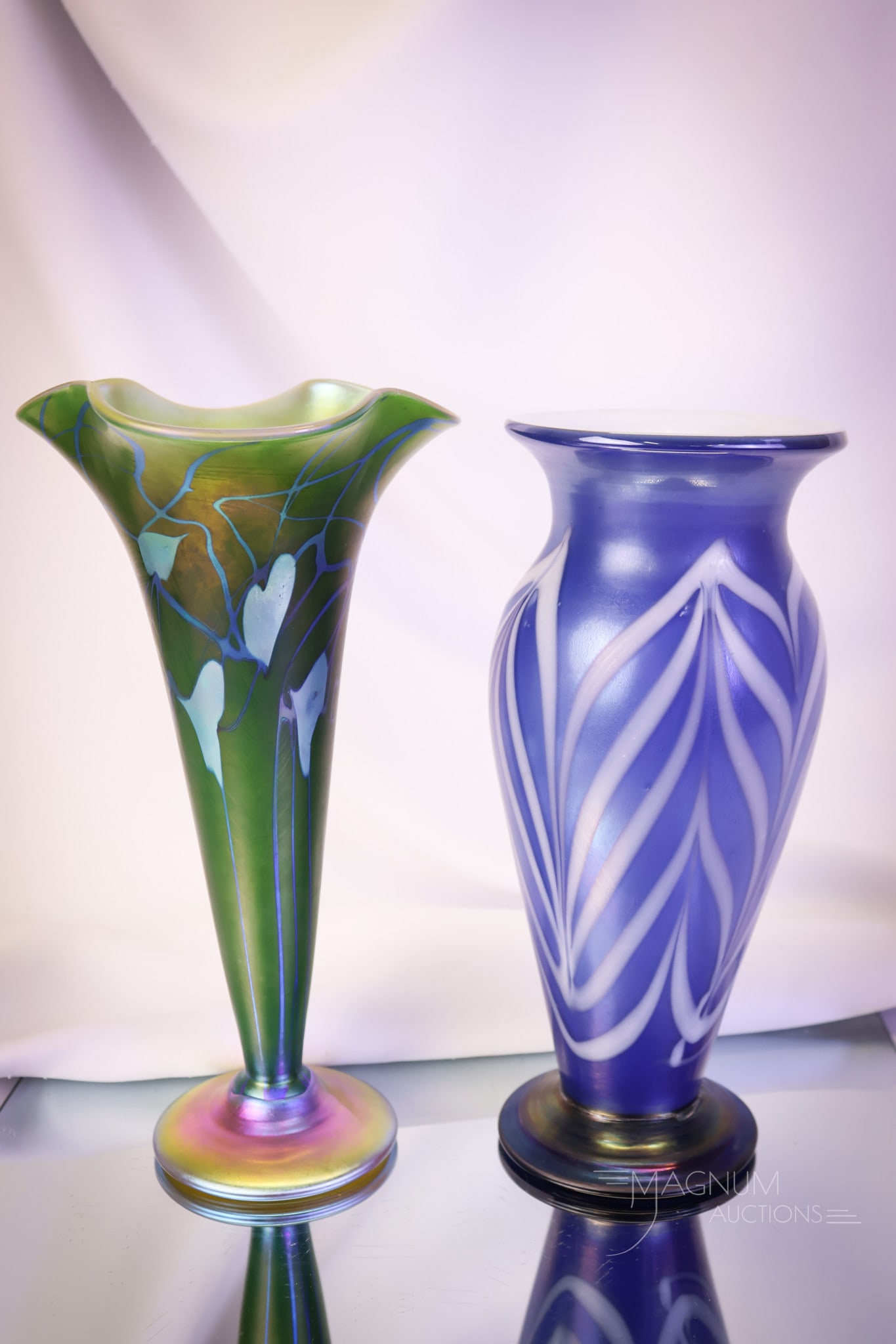 2 pc Lot Contemporary Studio Art Glass: Two distinct finds in contemporary studio art glass. The first is probably a Lundberg example with a spurious Tiffany mark. It is decorated with an iridescent Heart and Vine motif. The second is an un