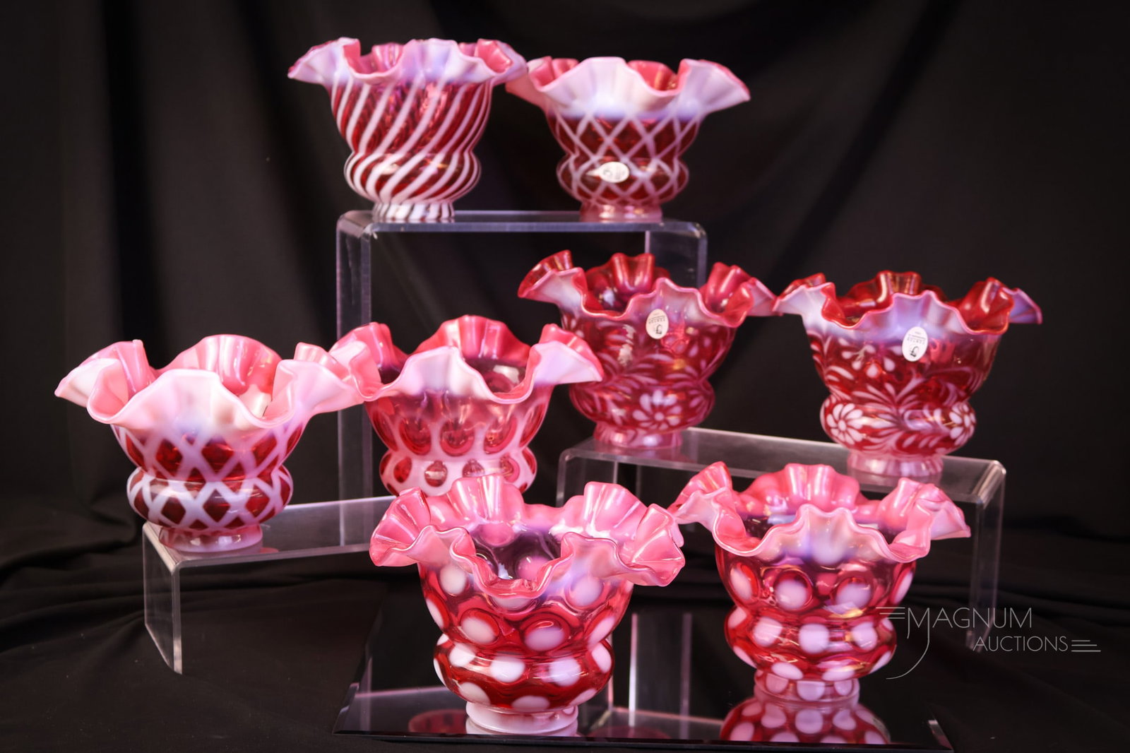 8 pc Lot Fenton Cranberry Opalescent Art Glass Shades: Eight desirable finds in Fenton cranberry opalescent art glass shades. A variety for your bidding pleasure. The tallest measures 4 1/2". SHIPPING NOTICE: If you choose not to utilize the LiveAuctionee