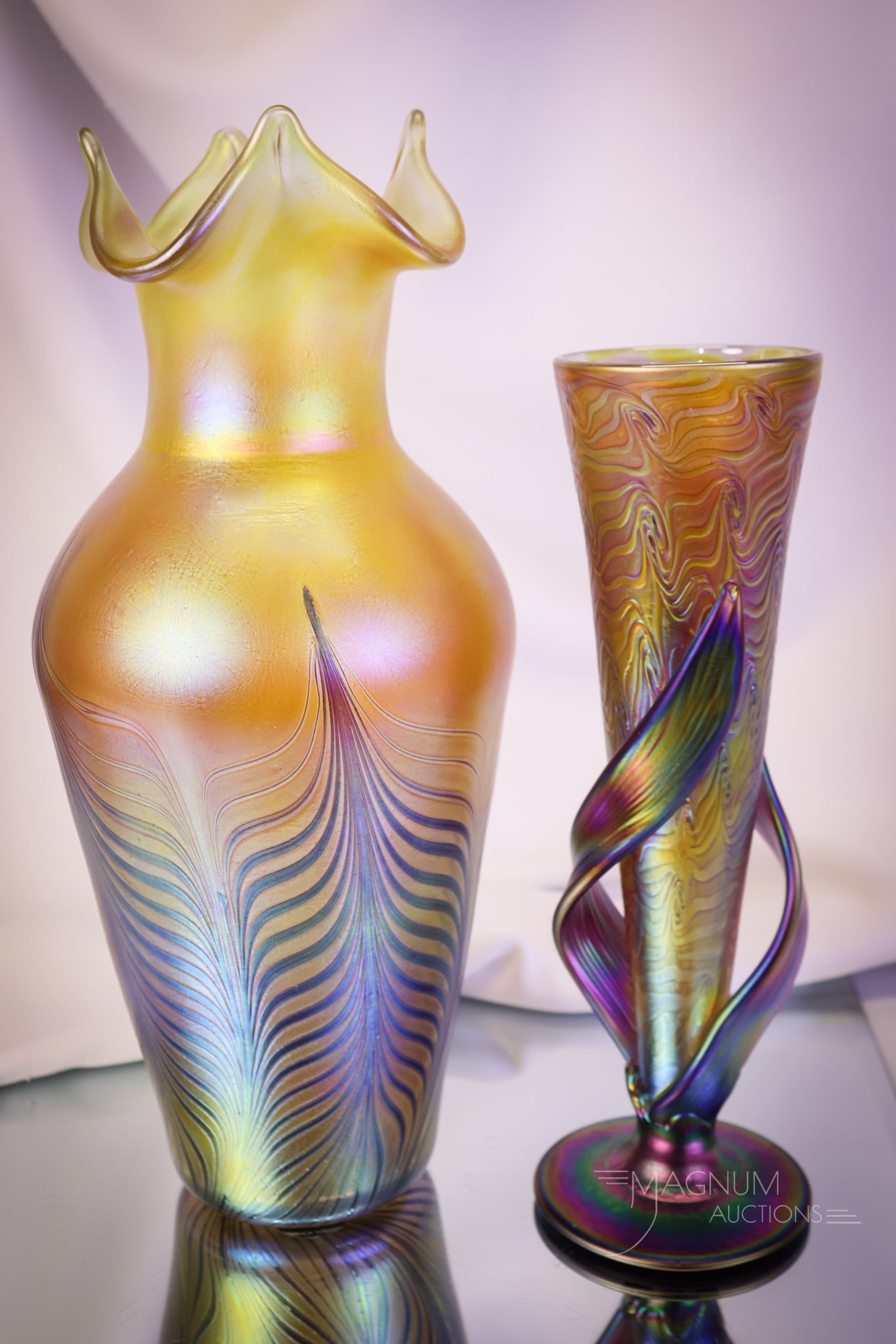 2 pc Lot Contemporary Art Glass Vases Igor Muller & More: Two distinct finds in contemporary art glass. The first is an Igor Muller iridescent vase with applied leaves and a King Tut design. The second is a Czech Republic gold iridescent pulled feather examp