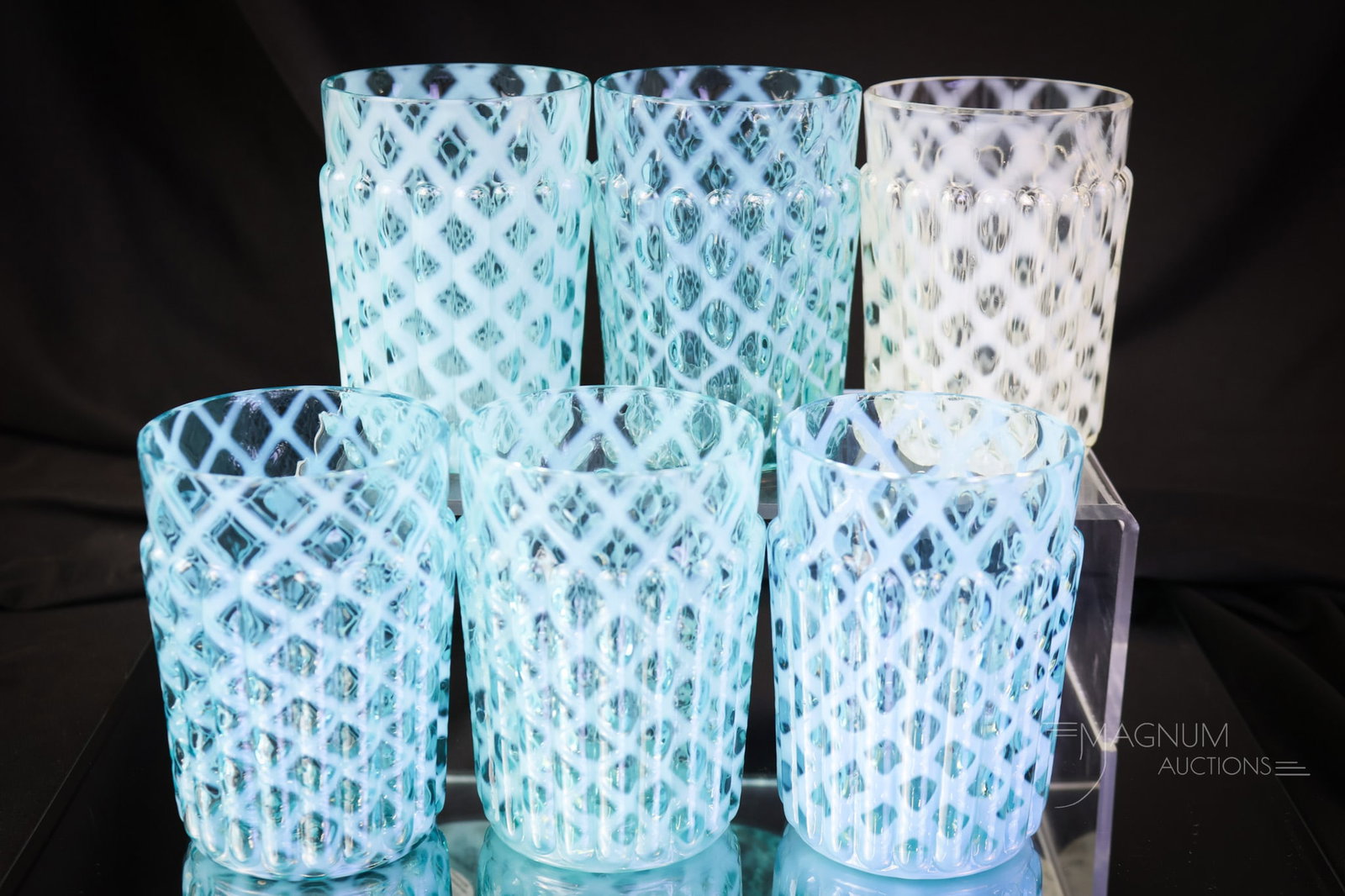 6 pc Lot Northwood Ribbed Opalescent Lattice Victorian Glass Tumblers: This lot has five blue and one crystal opalescent examples of Northwood's Ribbed Opal Lattice pattern. Hard to find when you need them! The tallest of the offerings measures 3 3/4". SHIPPING NOTICE: I