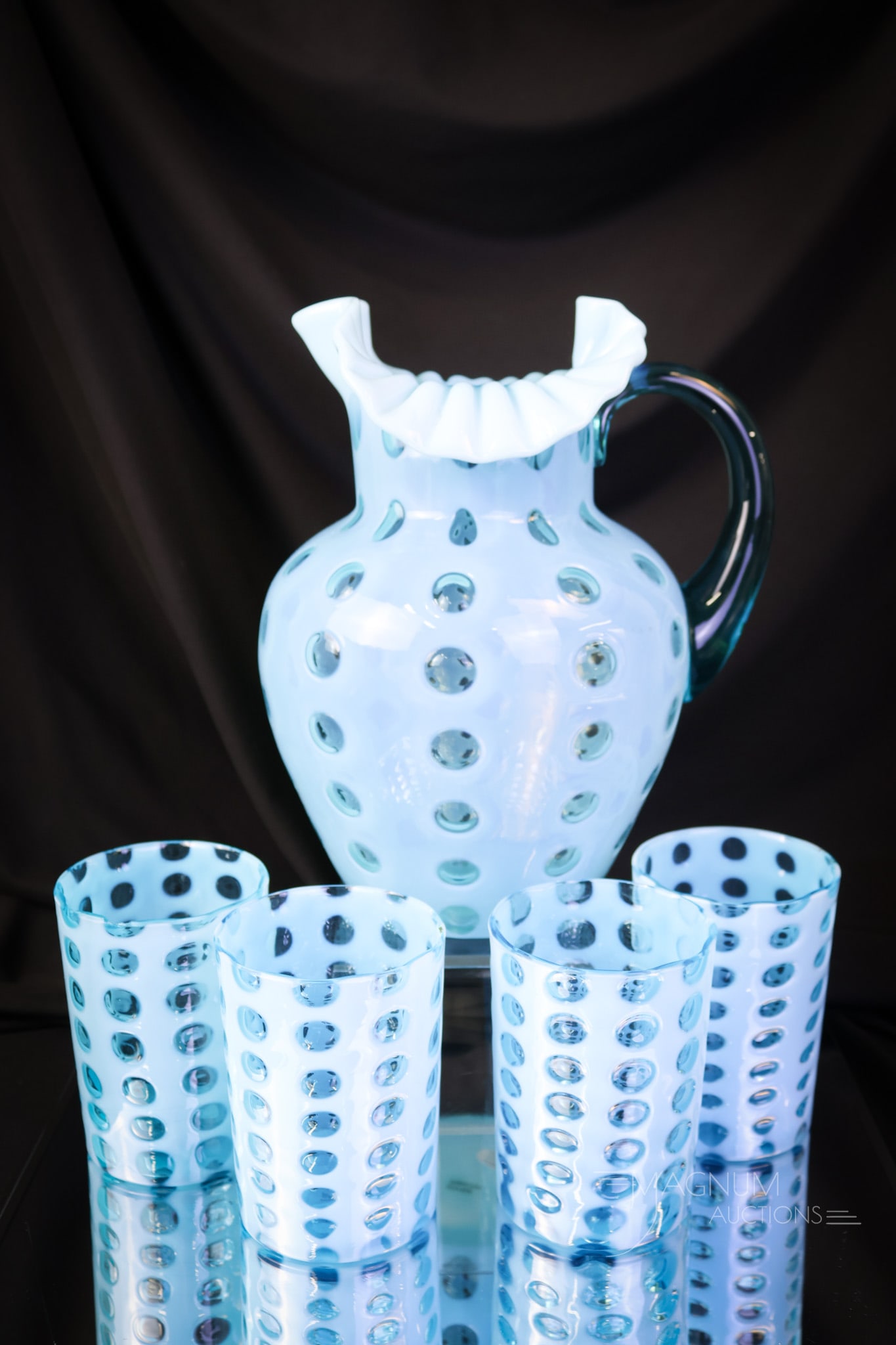 5 pc Northwood Blue Opalescent Victorian Polka-Dot Water Set: A generous offering of a five-piece Northwood blue opalescent Polka-dot pattern water set. The set consists of a pitcher and four tumblers. Two tumblers exhibit minor rim chips. The tallest of the set