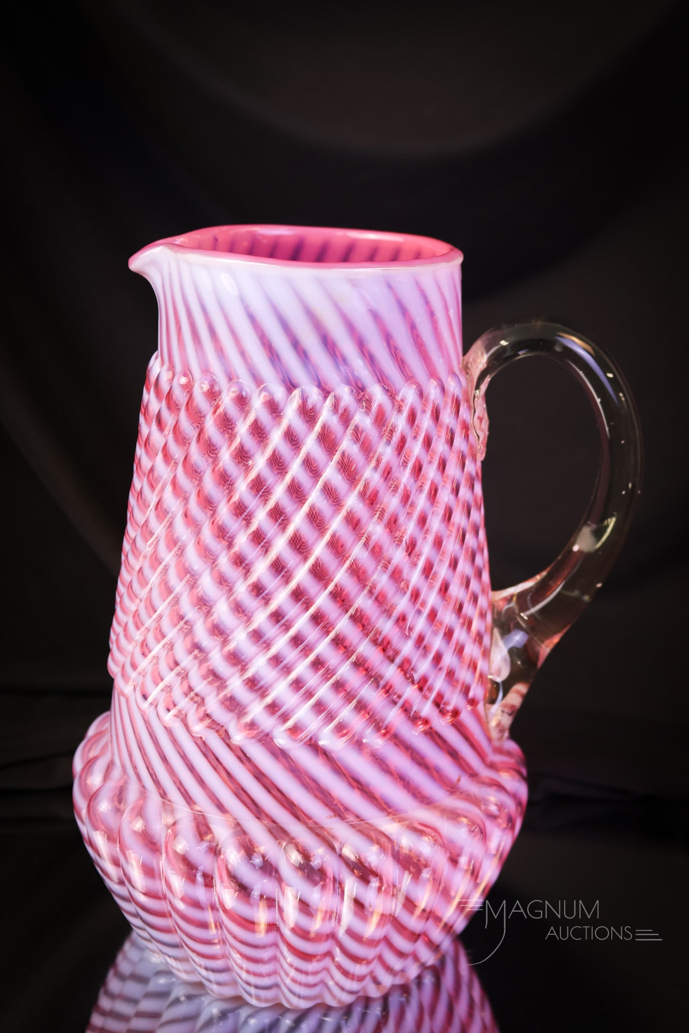 Northwood Cranberry Opalescent Victorian Chrysanthemum Base Swirl Glass Water Pitcher: So seldom seen. This is a primo example! This water pitcher has great cranberry coloring and crisp opal stripes. Make this Northwood pitcher yours today! The pitcher measures 9" tall. SHIPPING NOTICE: