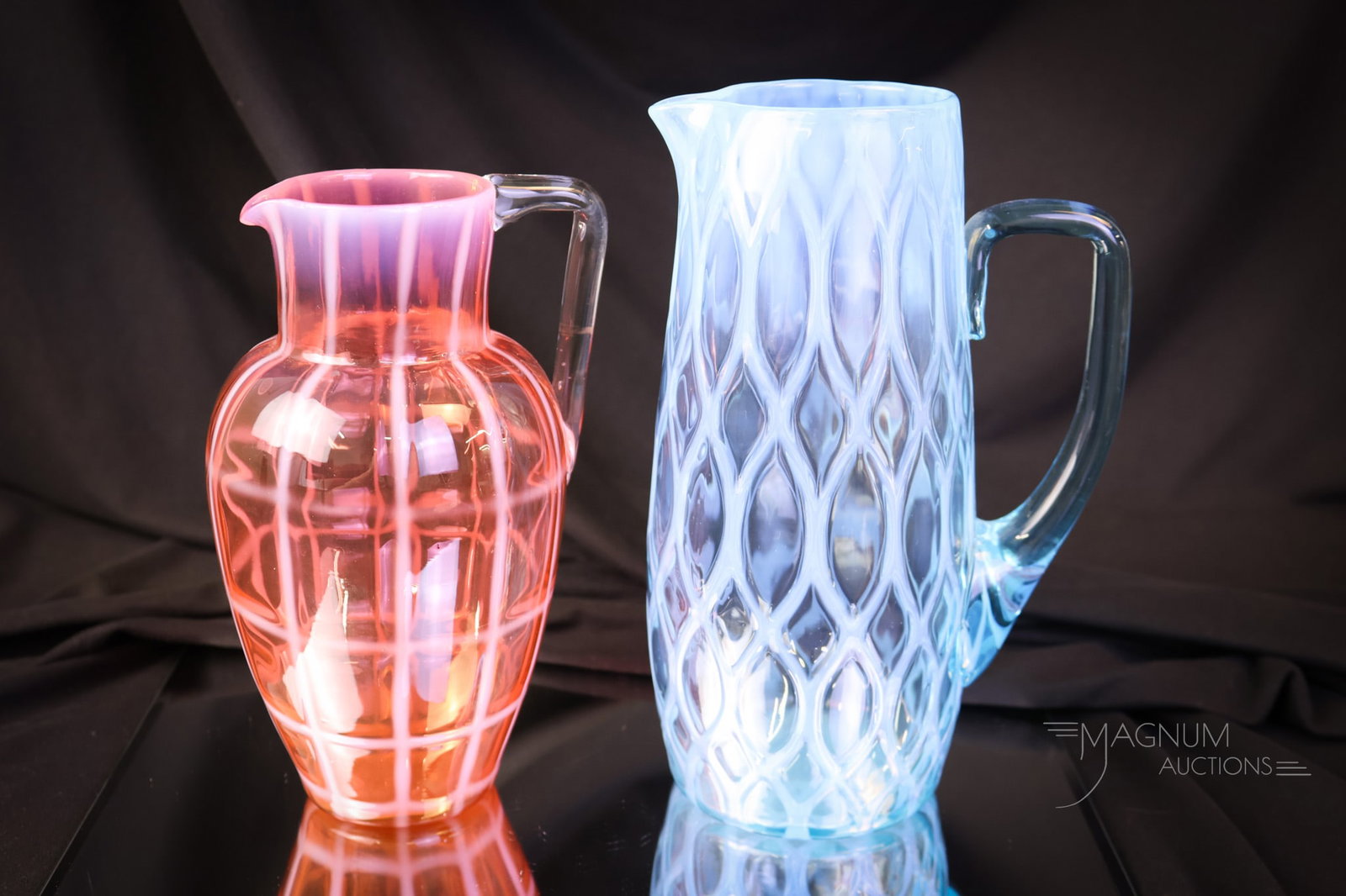 2 pc Lot Rare Victorian Opalescent Glass Pitchers: Two fine and rare Victorian opalescent pattern milk pitchers. The first is a blue Ellipse-and-Diamond example with an applied angular handle. The second is a bittersweet-colored opal pitcher in a Grid