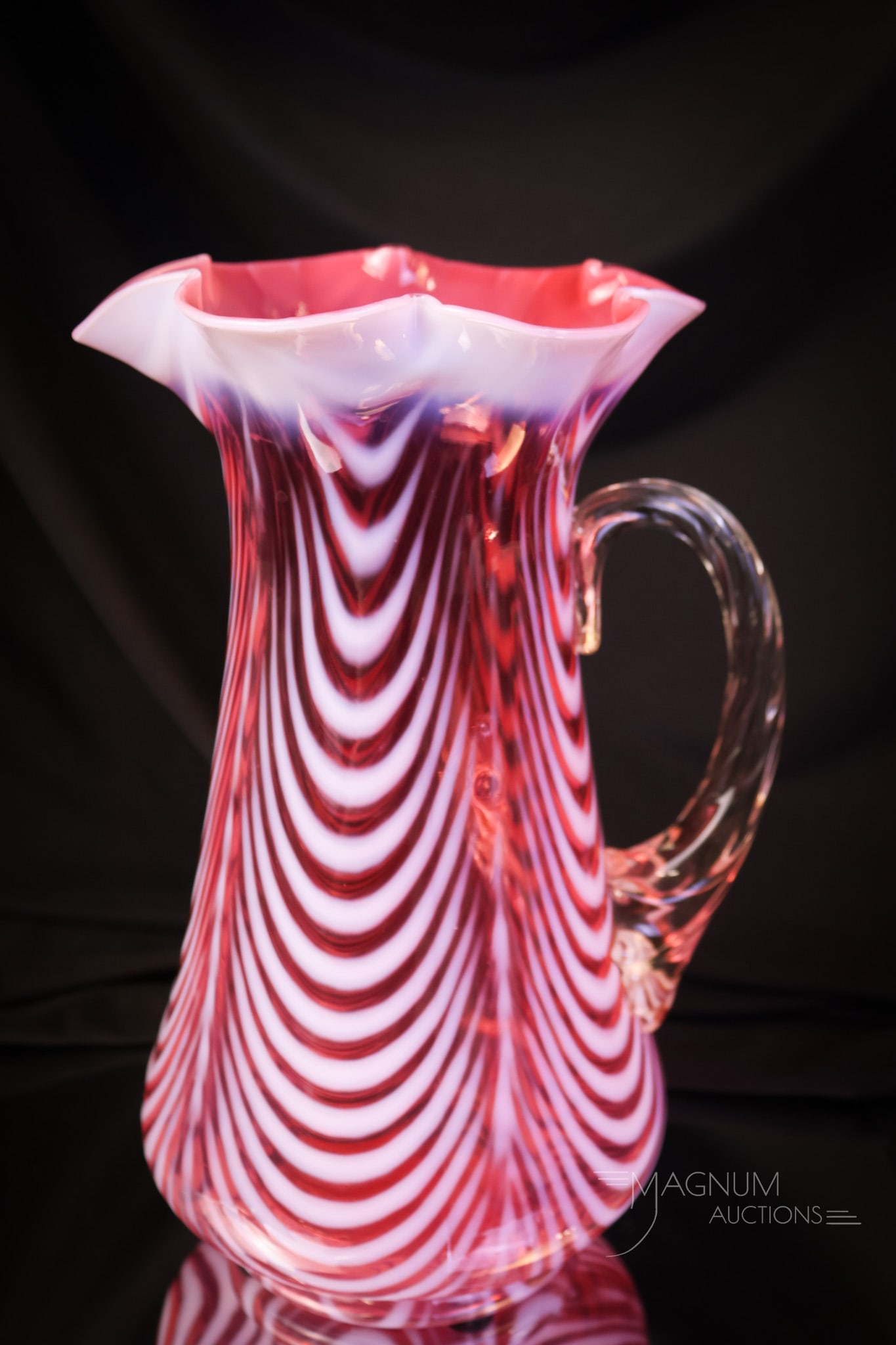 Exceptionally Rare Northwood Cranberry Opalescent Water Pitcher: Folks, take note of this ultra-rare pitcher. This is the Opal drape pattern by Northwood on the Blown Twist shape blank. The only known example thus far. This one has rich cranberry coloring and brill