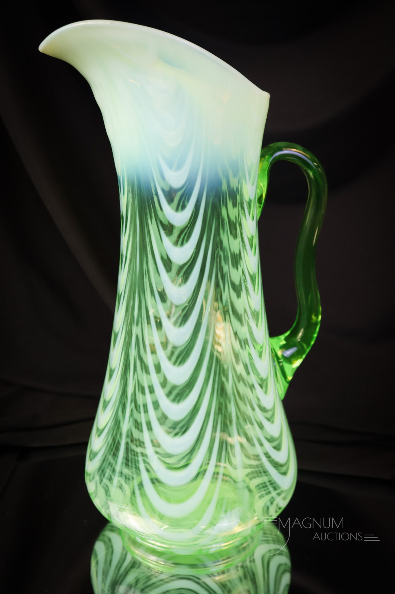 Northwood Uranium Green Opalescent Drape Tankard Victorian water Pitcher: This is a glowing find! This pitcher is in uranium-rich green opalescent glass in the Drape pattern. The tankard pitcher measures 12 1/2" tall. SHIPPING NOTICE: If you choose not to utilize the LiveAu