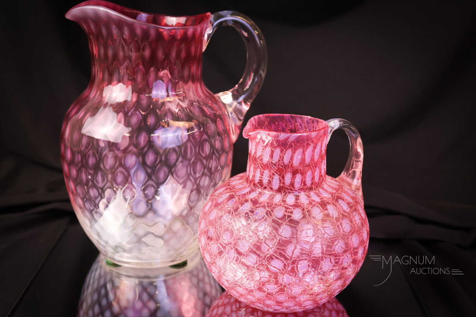 2 pc Lot Phoenix Victorian Opalescent Glass Pitchers: Two unique finds in Victorian glass Phoenix pitchers. The first is a rubina opalescent Baby Coinspot pattern water pitcher. The second offering is a cranberry opalescent craquelle baby Coinspot milk p