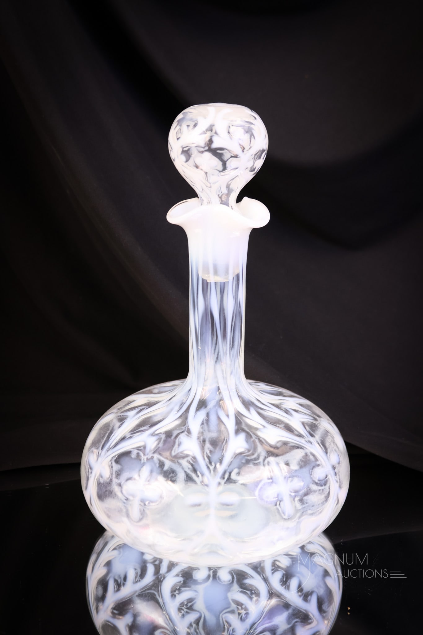 Northwood Victorian Opalescent Glass Spanish Lace Genie Bottle Decanter: A scarce find in a Victorian Northwood opalescent glass item. This is a decanter in the Spanish Lace pattern. The form is a genie bottle. This decanter comes complete with the matching opalescent stop