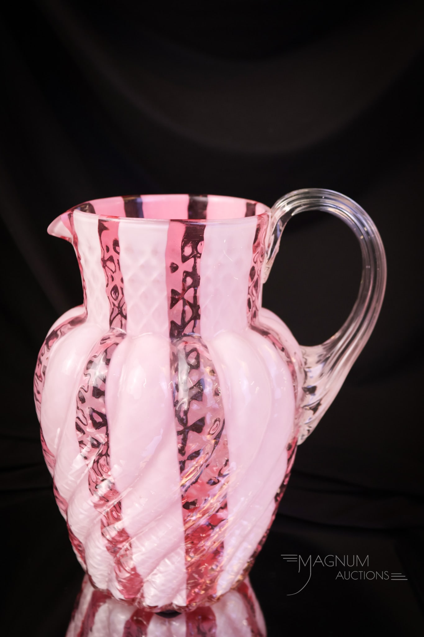 Phoenix Cranberry Opalescent Diamond Quilt Wide Stripe Water Pitcher: Here's a beautiful piece of glass from the Victorian era. This pitcher is attributed to Phoenix. It is in the cranberry Diamond Quilt Wide Stripe pattern. Excellent color and opal on this one! The pit
