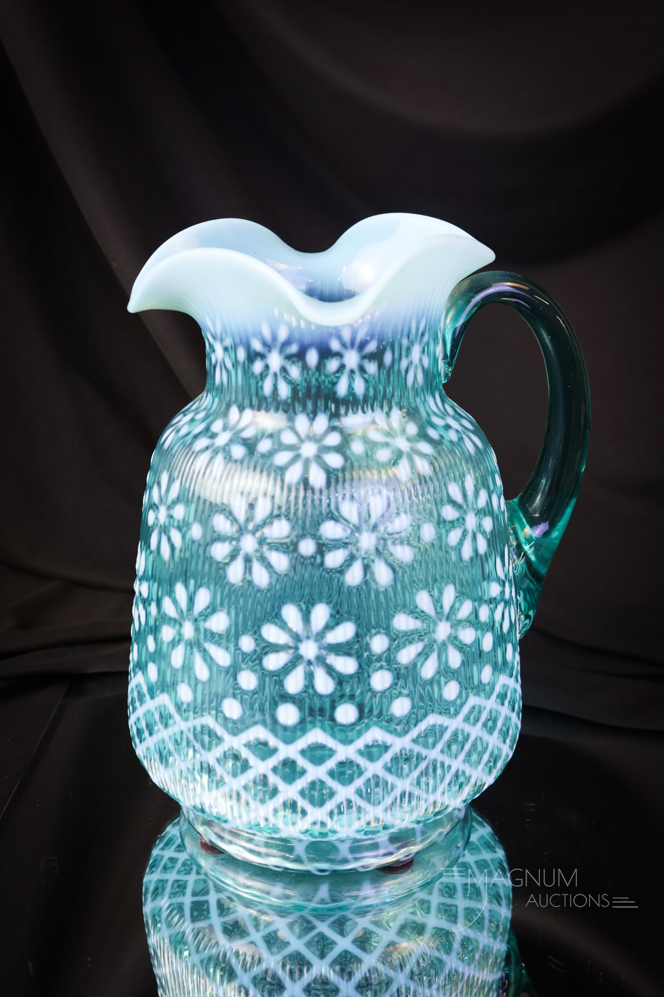 Northwood Blue Opalescent Victorian Glass Christmas Snowflake Water Pitcher: A seldom seen color. This Christmas Snowflake pattern water pitcher was made by Northwood. The pitcher has bright opal and great blue coloring. The pitcher stands 8 3/4" tall and 7" wide. SHIPPING NOT