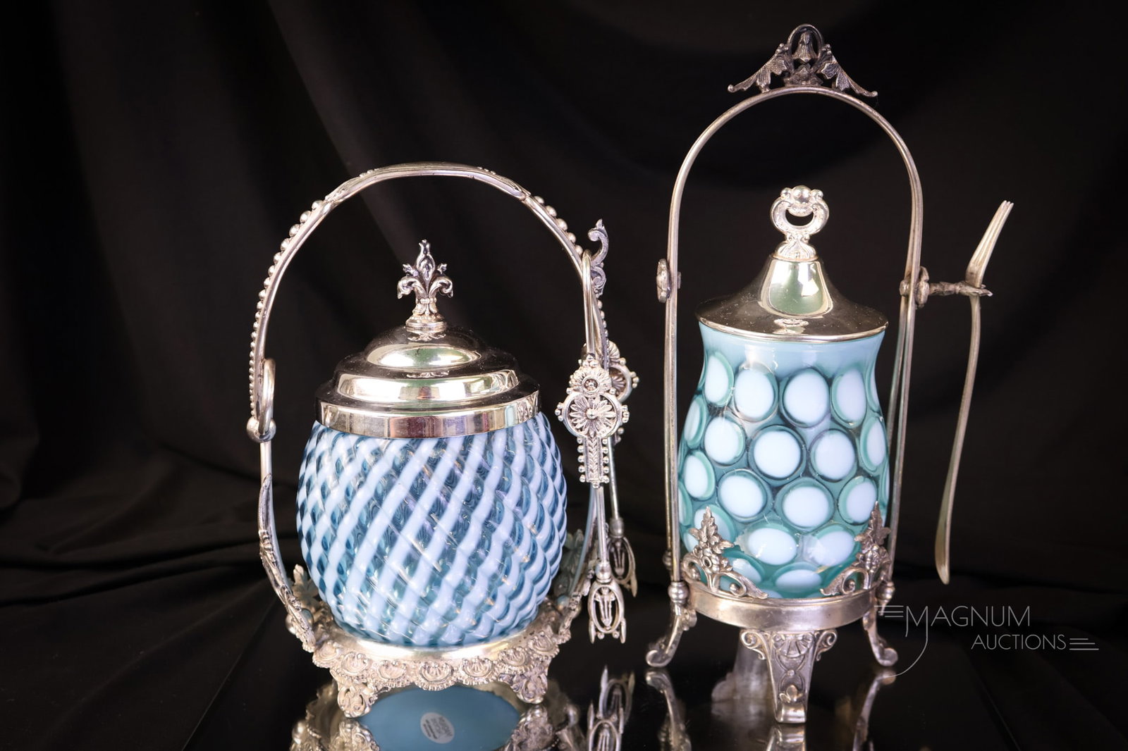 2 pc Lot Victorian Silverplate Blue Opalescent Glass Pickle Castors: Two fine examples of Victorian silverplate and blue opalescent glass pickle castors. The Coinspot pattern jar resides in a Simpson Hall and Miller frame. The Reverse Swirl pattern jar resides in a Mer