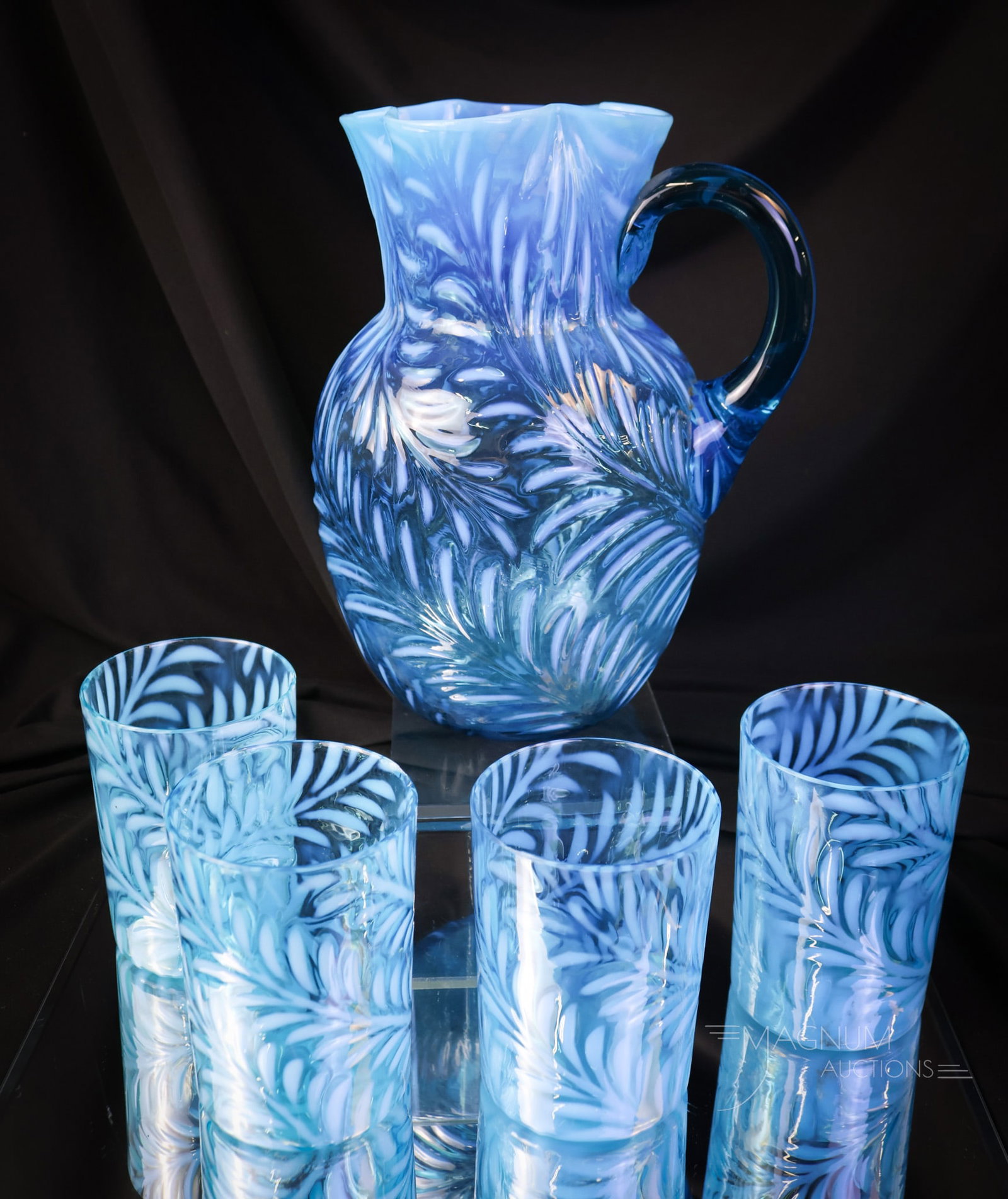 5 pc Blue Opalescent Polka Dot Victorian Glass Water Set: A wonderful, heavenly blue opalescent Polka-Dot pattern five-piece water set. This pitcher has a clover leaf -shaped top rim. The set includes four tumblers. The tallest of the offerings measures 8 3/