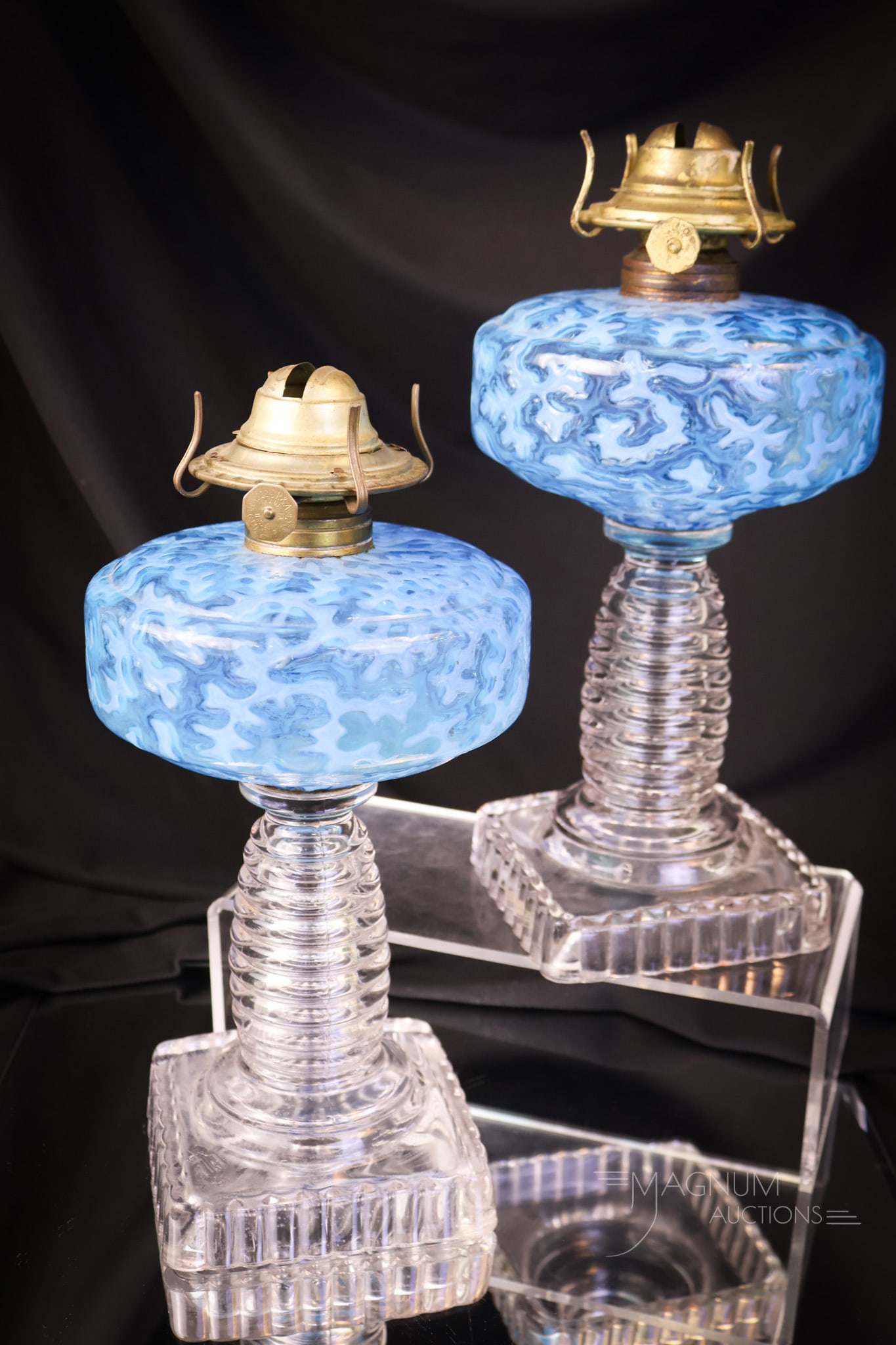 Pair of Blue Opalescent Victorian Glass Coral Oil Lamps: Two beautiful examples of blue opalescent Victorian glass Coral pattern oil lamps. Each has great blue coloring and fine opal. Each measures 8" tall to the burner collar. SHIPPING NOTICE: If you choos