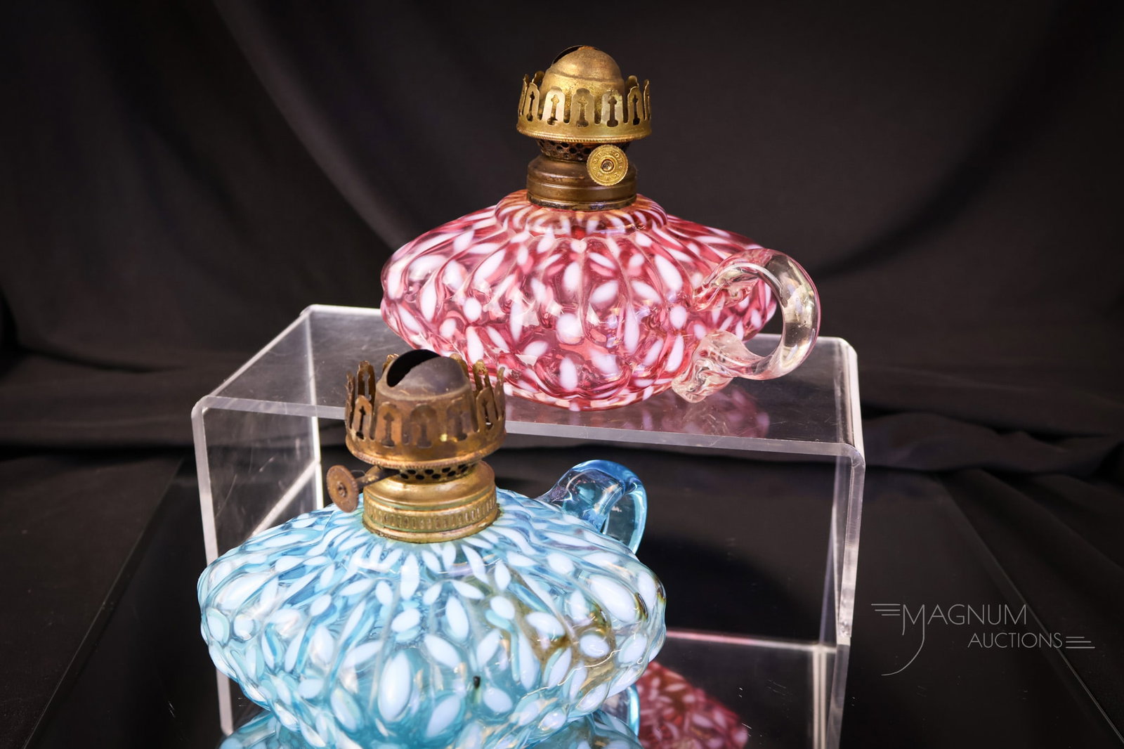 2 pc Lot Victorian Opalescent Glass Cranberry & More Finger Oil Lamps: Two great finds in Victorian opalescent finger oil lamps. Both are in the Christmas Snowflake pattern. One is in cranberry, and one is in blue. The tallest measures 2" to the burner collar. SHIPPING N