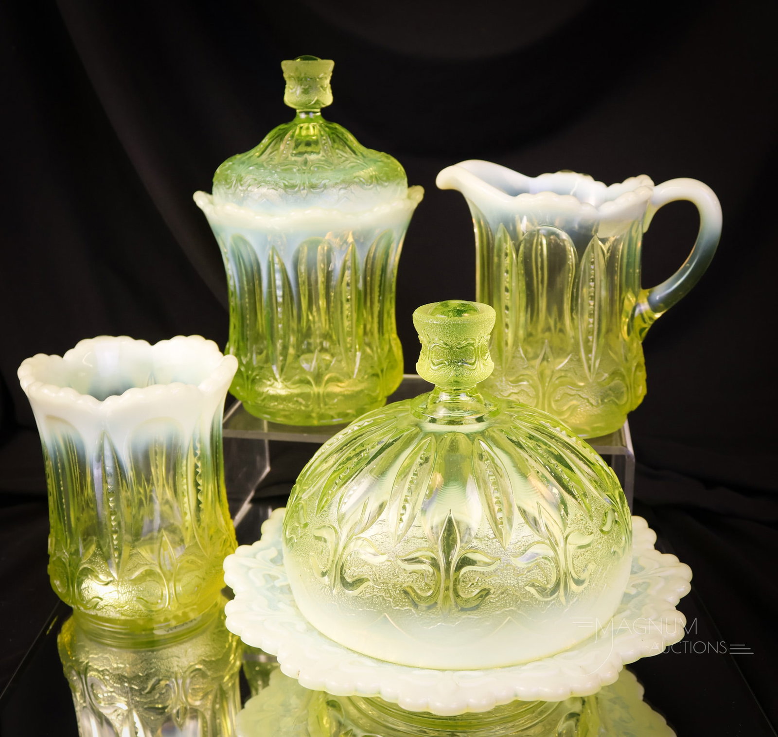 4 pc Jefferson Vaseline Opalescent Iris with Meander Uranium Glass Table Set: A fine and complete offering of a vaseline opalescent uranium-rich table set in Jefferson's Iris with Meander pattern. This set is comprised by the butter, sugar, creamer, and the spooner. The tallest