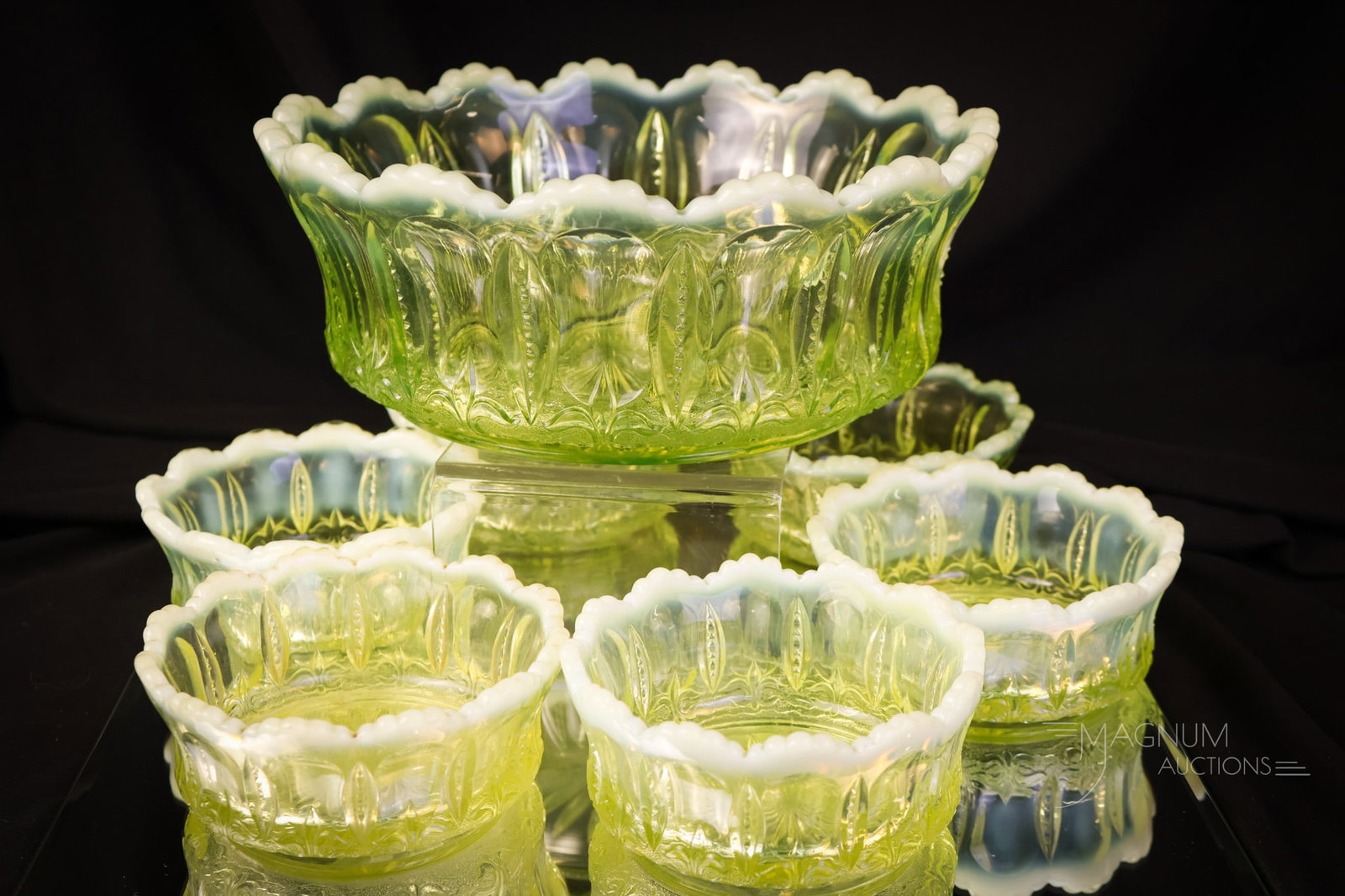 7 pc Set Jefferson Iris with Meander Vaseline Uranium Opalescent Glass Berry Set: A complete offering of a vaseline opalescent uranium-rich berry set in the Jefferson Iris with Meander pattern. This set includes the master bowl and six individual berry bowls. The tallest measures 3