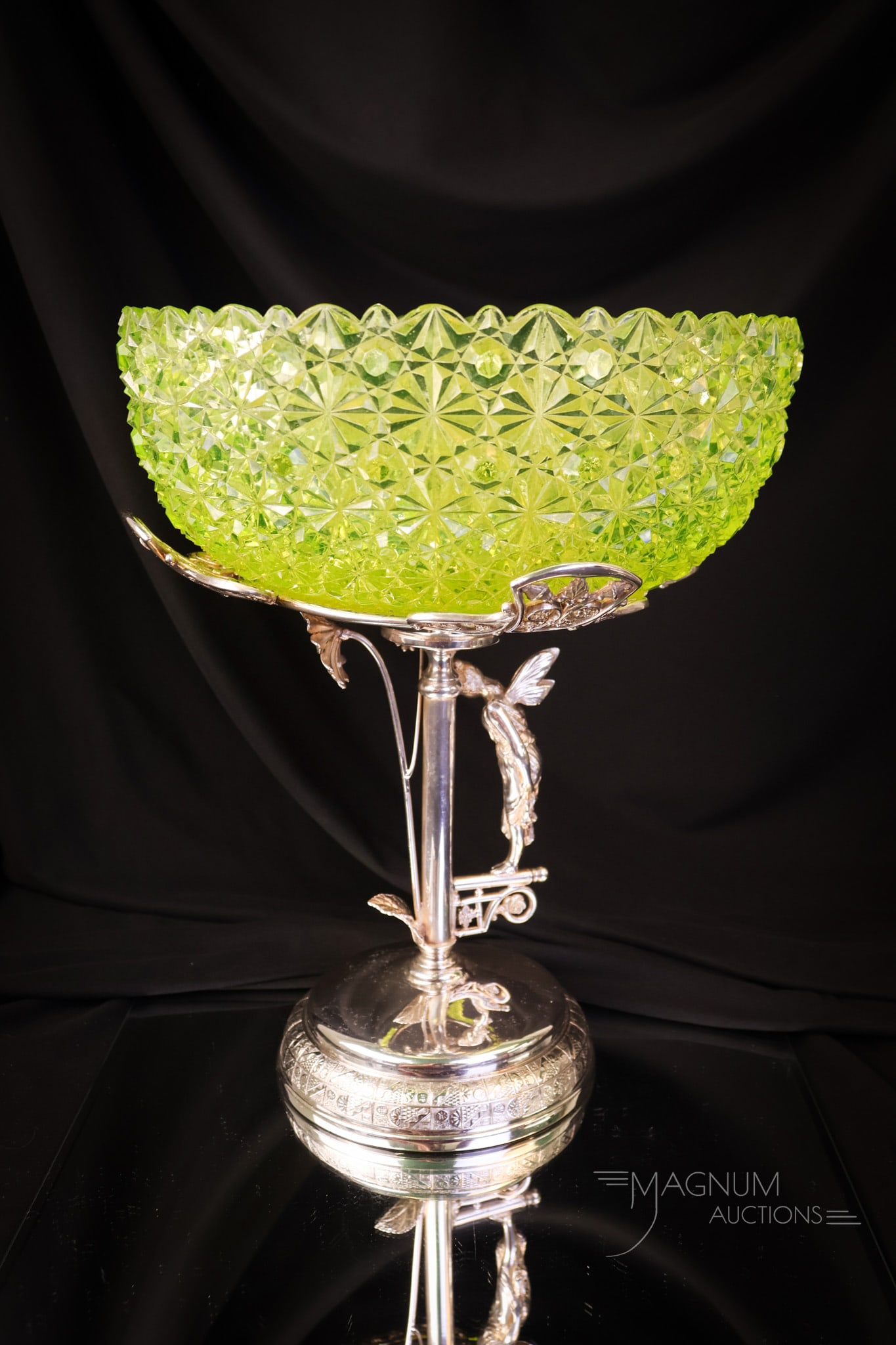 Derby Silverplate Victorian Vaseline Daisy & Button Brides Bowl: A beautiful Victorian bride's bowl in vaseline glass set in a signed Derby silverplate figural holder. The bowl is in the Daisy & Button pattern. The holder features a one-armed fairy looking down at 