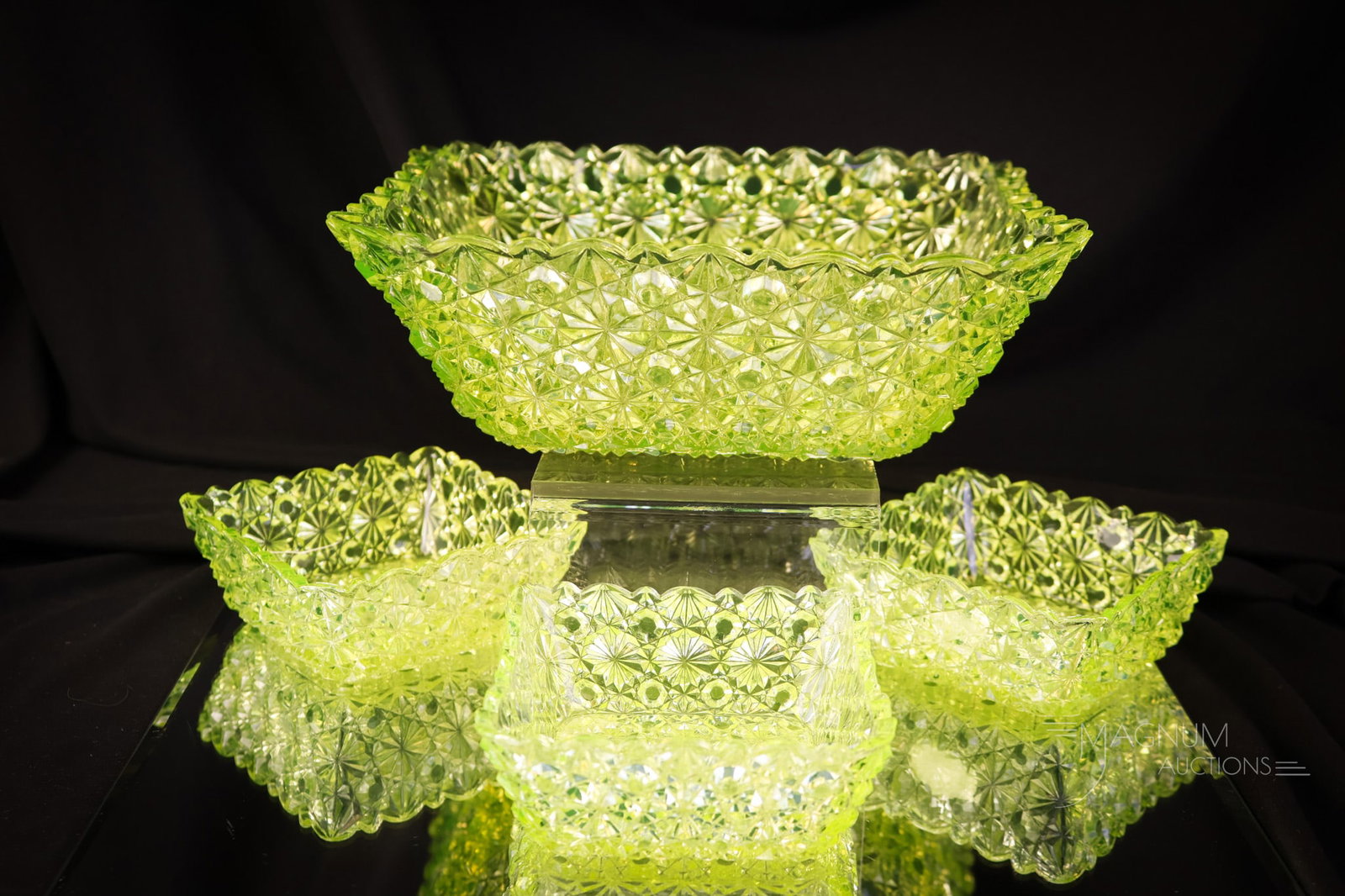 4 pc Hobbs Vaseline Daisy & Button Victorian Uranium Glass Berry Set: A Hobbs vaseline uranium-rich Victorian Daisy and Button berry set. This set includes the large bowl and three individual bowls. The largest measures 3" tall and 8 1/2" wide. The large bowl exhibits a