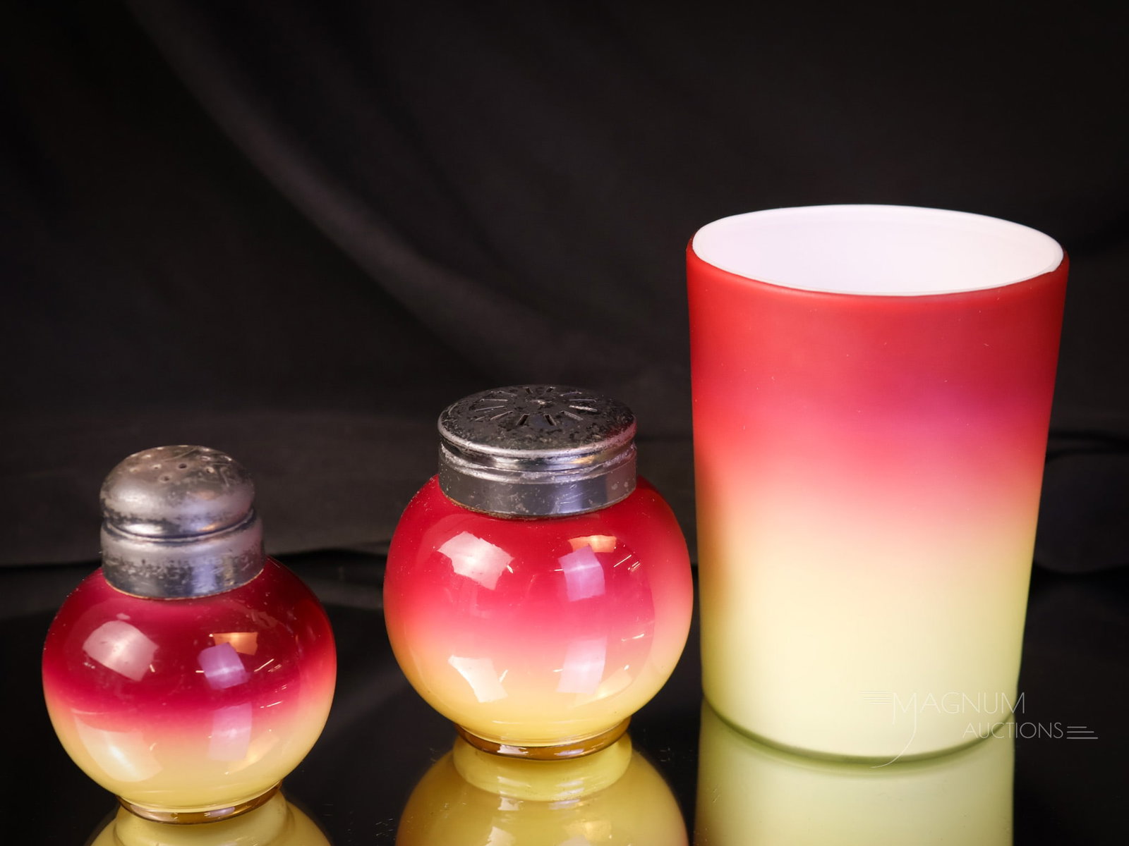 3 pc Lot Victorian Wheeling Peachblow Art Glass: Three selections in one lot of Victorian Wheeling Peachblow. The lot includes a satin tumbler, a large salt shaker, and a small salt shaker. Each has great coloring. The tallest in the lot measures 3 
