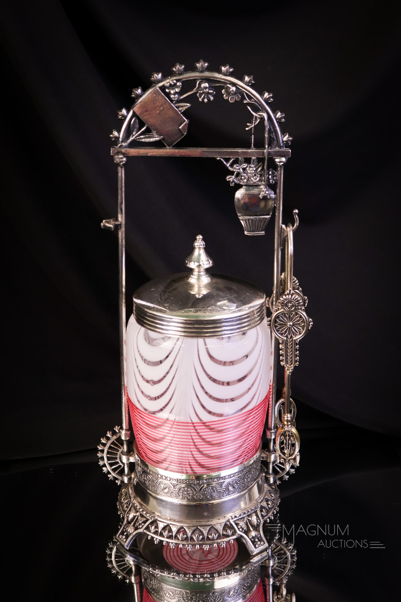 Middletown Victorian Silverplate Hobbs Threaded Nailsea Art Glass Pink Pickle Castor: A beautiful find in a Victorian pickle castor. This super piece features an ornate Middletown silverplate Victorian frame. The frame has a hanging flower basket at the top of the handle. The jar was m