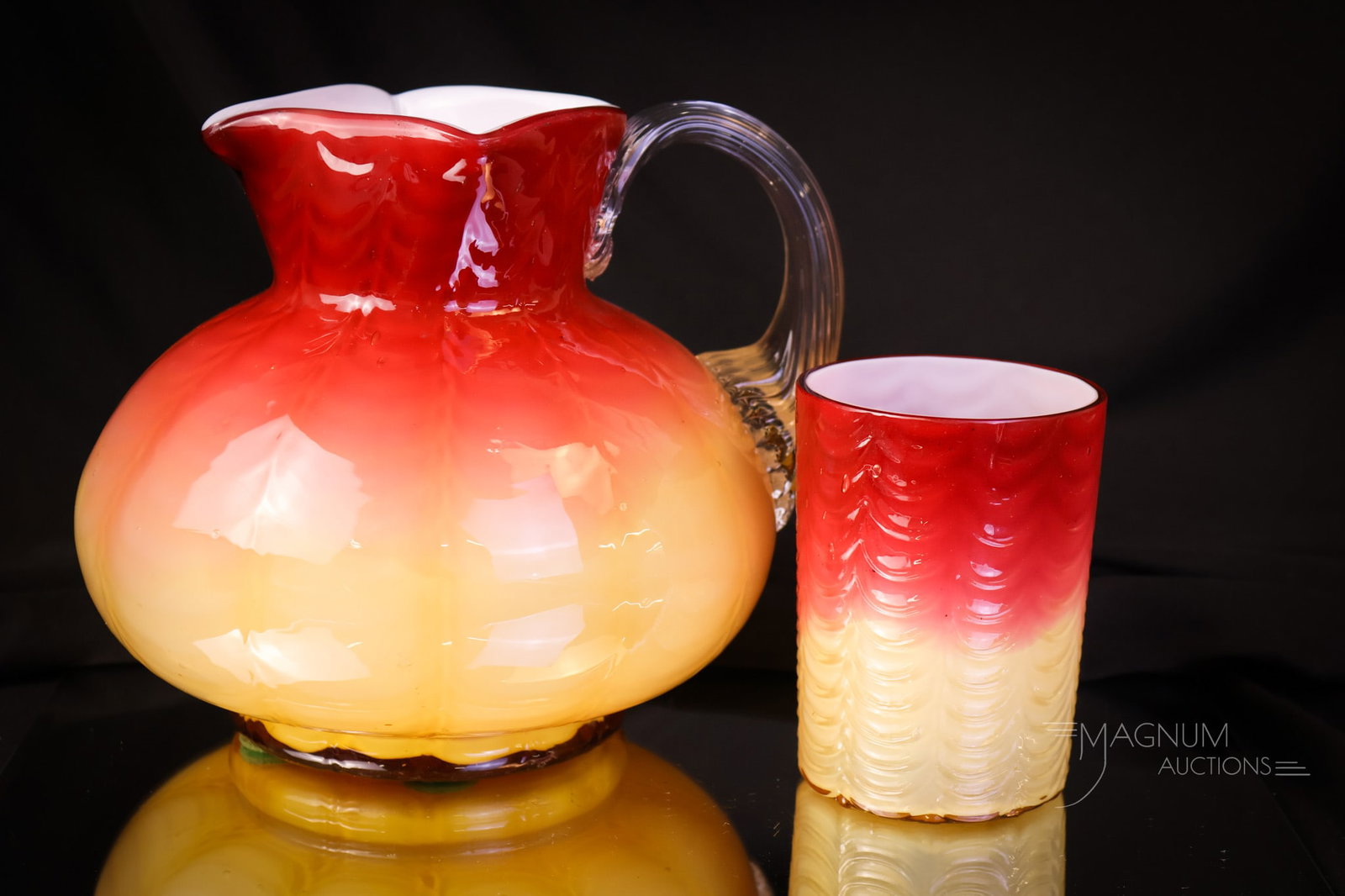 Phoenix Drape Peachblow Victorian Art Glass Pitcher & Tumbler: A great addition to any collection is this attributed to Phoenix peachblow art glass great color pitcher and tumbler. The pitcher and tumbler are in the Drape pattern. The tallest measures 6". SHIPPIN