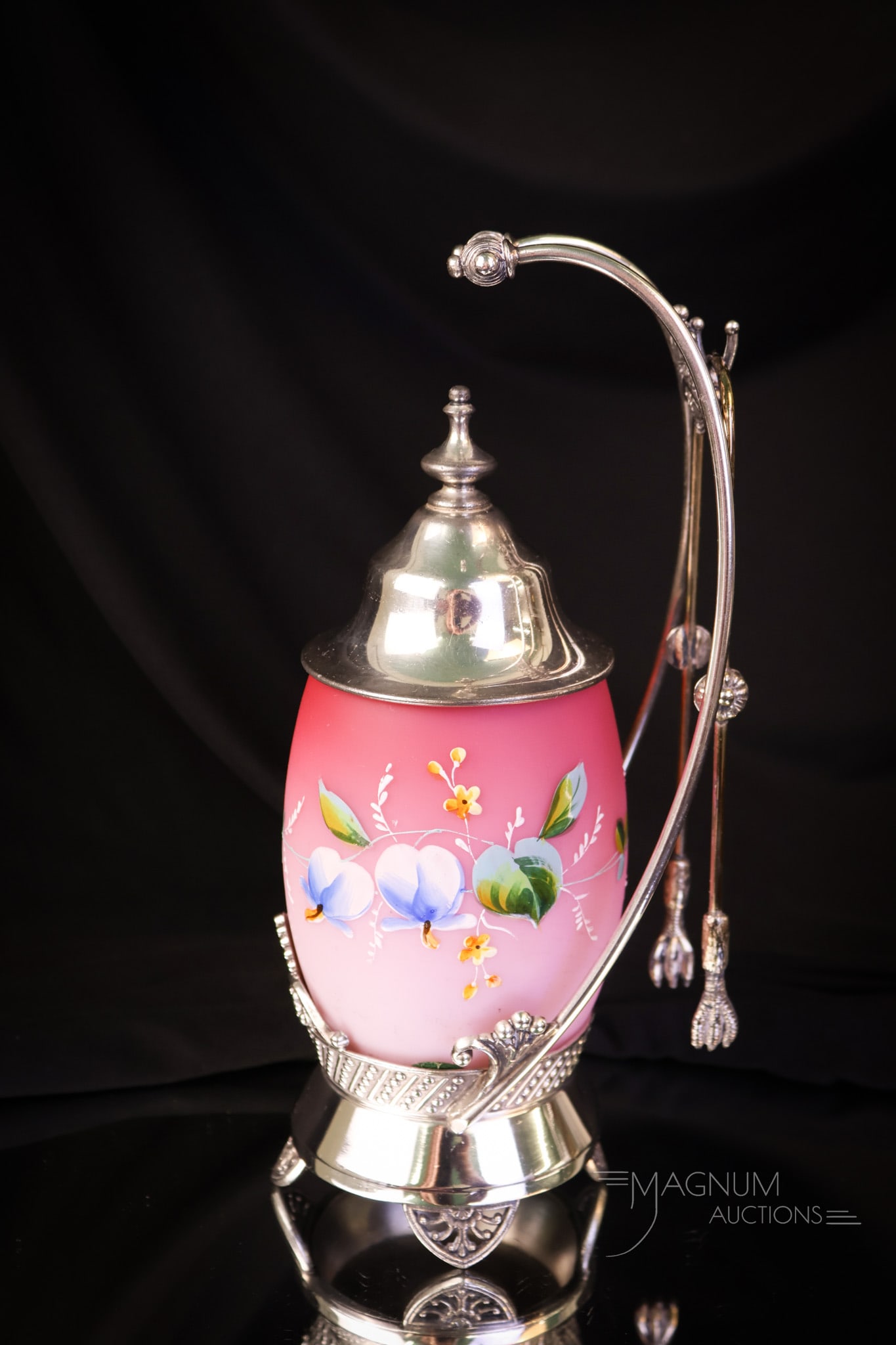 Tufts Silverplate Victorian Enameled Glass Pickle Castor: A gorgeous addition to any collection. This is a signed Tufts silverplate pickle castor complete with a pink satin enameled glass jar. The piece measures 10" tall and 5" wide. SHIPPING NOTICE: If you 