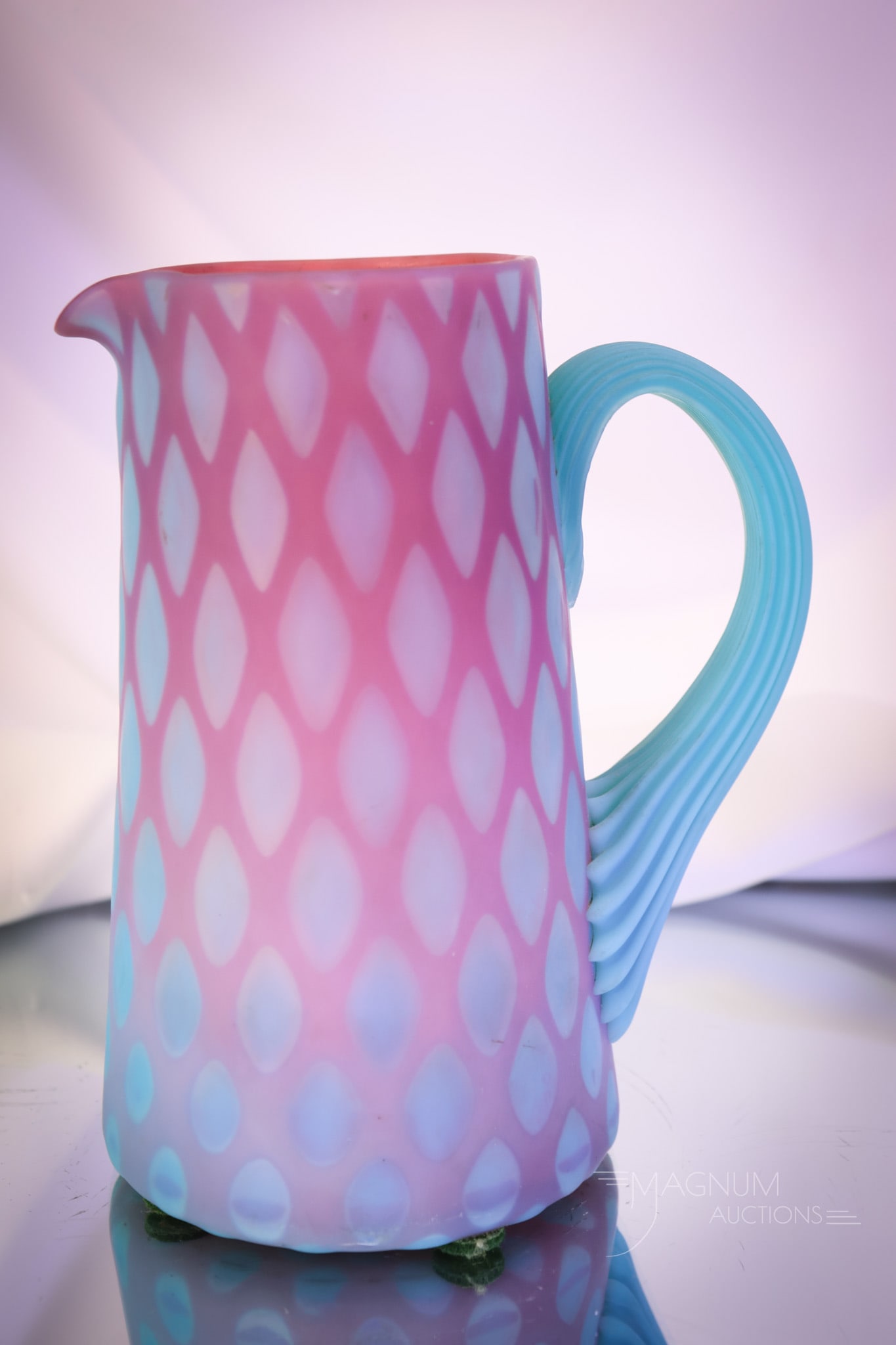 Very Rare Phoenix Victorian Mother of Pearl Bluerina Satin Glass Pitcher: An absolutely gorgeous Victorian Phoenix Bluerina mother-of-pearl satin diamond quilted milk pitcher. This phenomenal piece is ultra rare and simply luscious. The pitcher has an applied blue opalescen