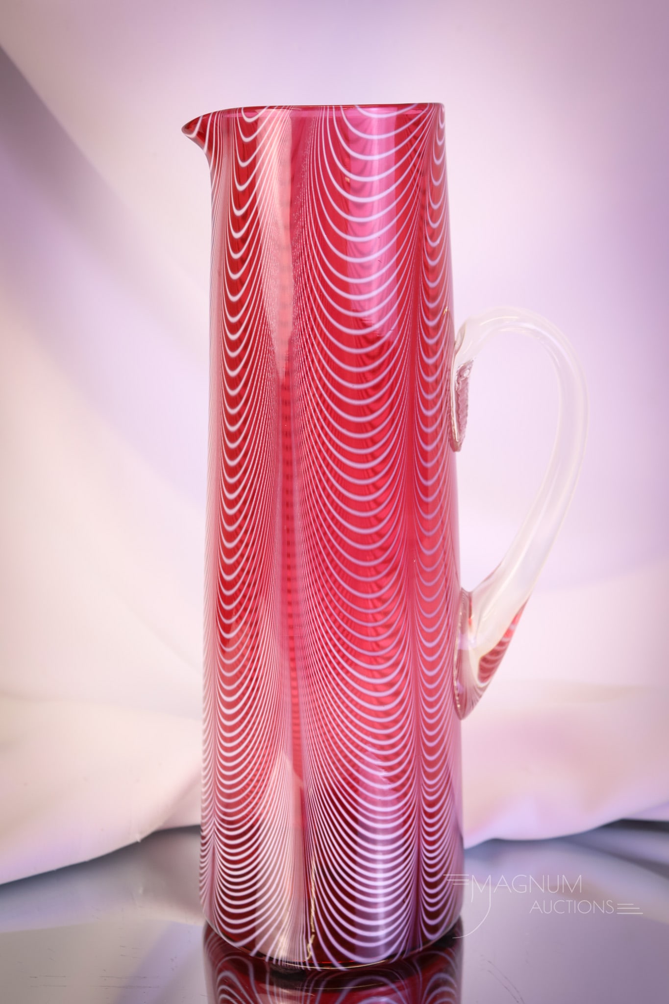 Very Rare Phoenix Cranberry Victorian Nailsea Art Glass Tankard Water Pitcher: A very rare find in Victorian Phoenix Glass. This tankard pitcher measures 12" tall. It is in cranberry glossy Nailsea glass. This excellent example will be a prized piece in any art glass collection!