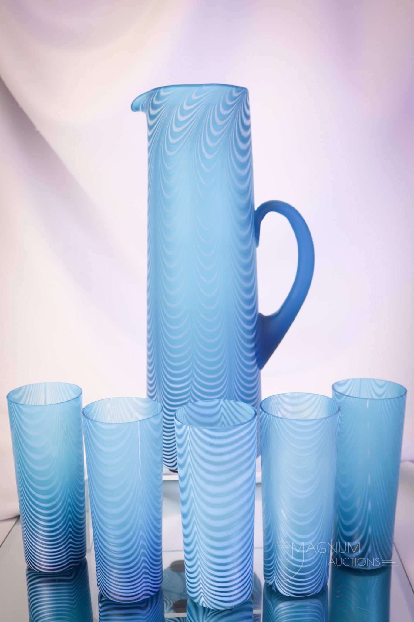Very Rare Victorian Phoenix Blue Nailsea Art Glass Tankard Water Set: Yet another rare find in Victorian art glass. This Nailsea pattern tankard water pitcher has the best color and has five tumblers to complete the set. Such a very rare offering. The pitcher measures 1