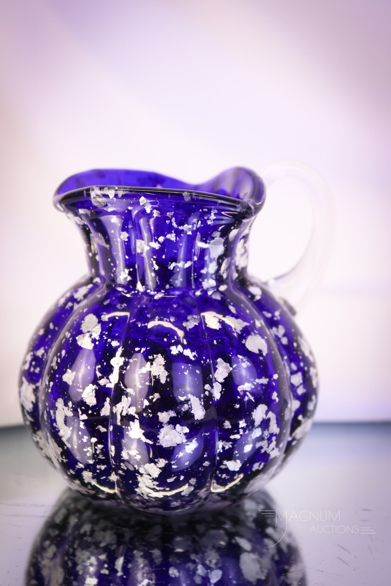 Hobbs Cobalt Silver Spangle Art Glass Cream Pitcher: Another fine offering of Hgobbs spangle glass. This cobalt cream pitcher has silver mica inclusions and a clear applied handle. The creamer measures 3 3/4" tall. A nice find! SHIPPING NOTICE: If you c