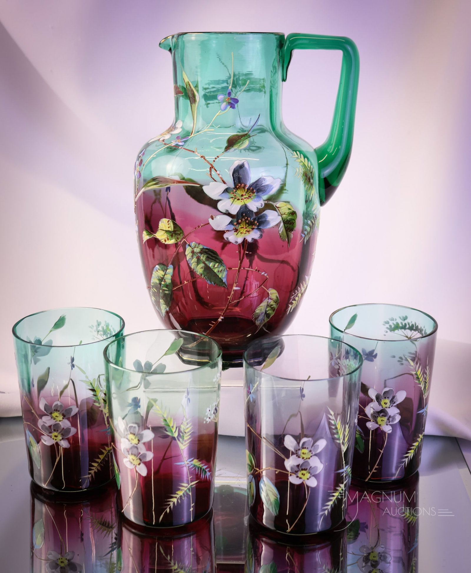 Rare Greenarina 5 pc Enameled Green Cranberry Victorian Glass Water Set: A rare find in Victorian glass. This is a greenarina five-piece water set. This green to cranberry offering includes a pitcher and four tumblers. Each piece is beautifully decorated with florals. The 