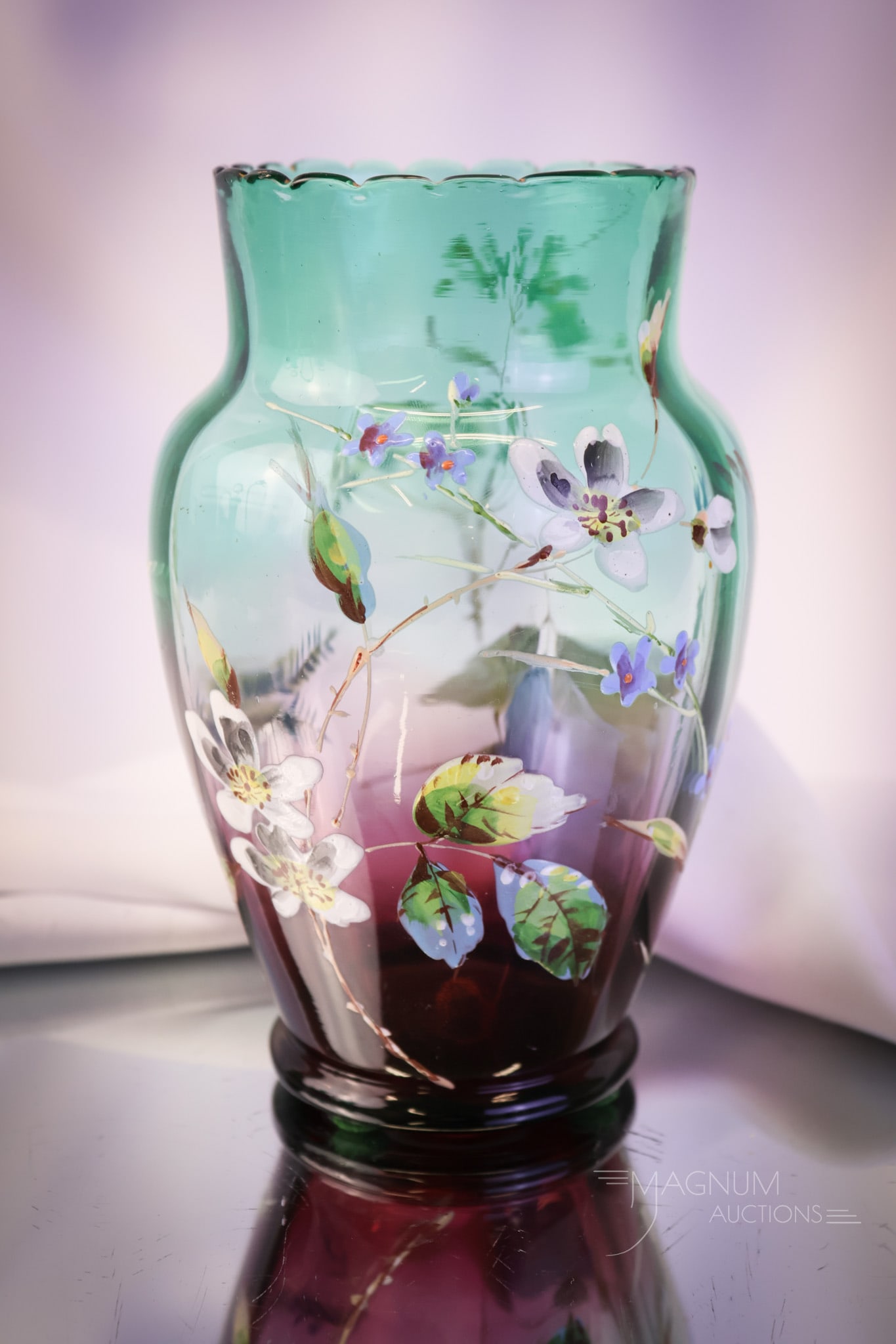 Scarce Victorian Greenarina Green Cranberry Enameled Glass Celery Vase: A scarce find in a Victorian celery vase. This one is in Greenarina glass or green to cranberry. It is enamel decorated with florals around the body. This piece measures 6 1/2" tall and 4" wide.. SHIP
