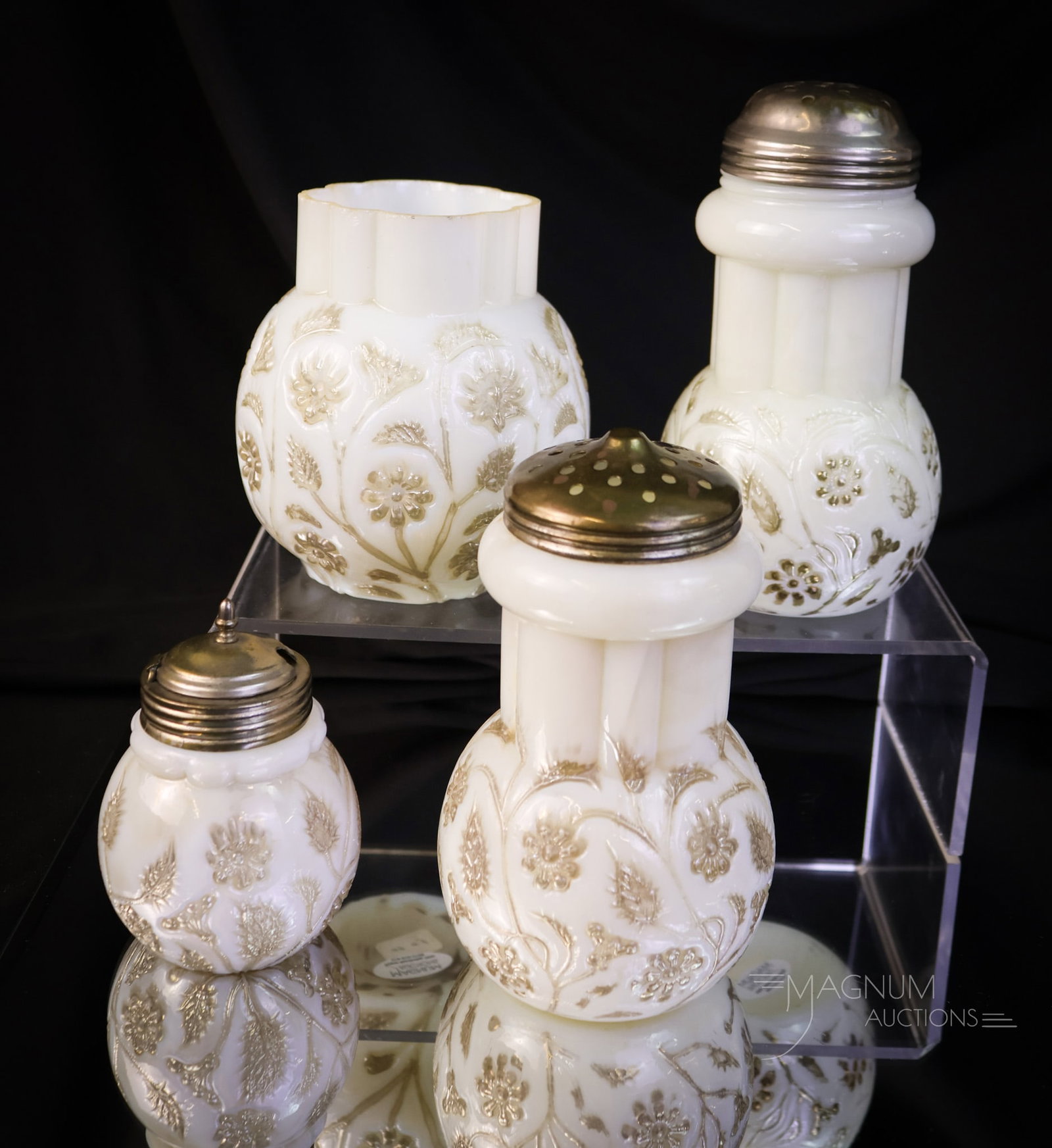 4 pc Lot Victorian Findlay Onyx Glass Sugar Shakers Mustard & More: Four delights that are sure to please in Victorian Findlay onyx, platinum-decorated glass. This lot offers two sugar shakers, a mustard jar, and, lastly, a spooner. The tallest measures 5 1/2" tall. T