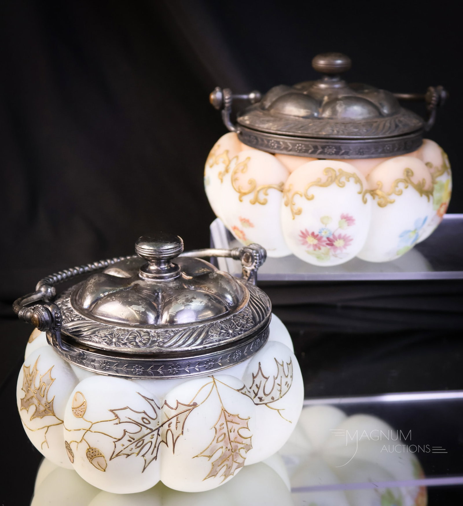 2 pc Lot Mt. Washington Crown Milano Glass Sweetmeat Jars: Two great finds in Victorian Mt. Washington Crown Milano decorated sweetmeats. The first is a blue colored lobed form jar with oak leaf and acorn decoration. The second is signed Crown Milano and is a