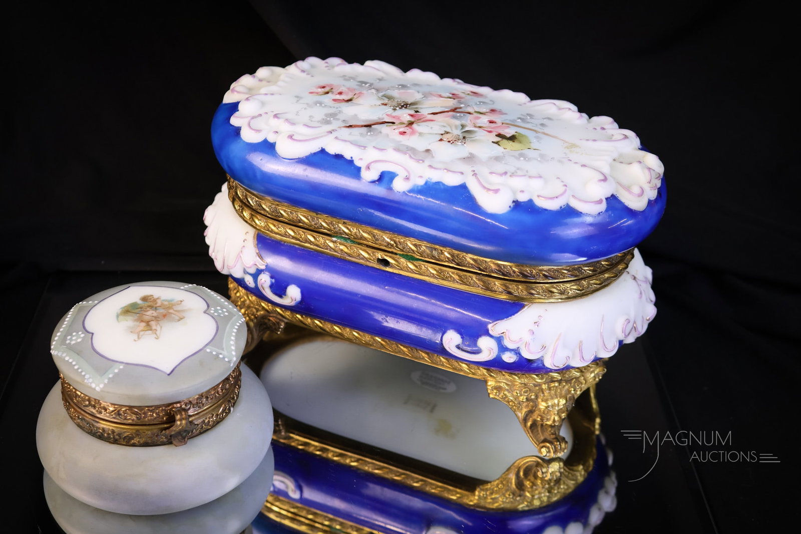 2 pc Lot Wave Crest Nakara & More Victorian Glass Boxes Glove & More: Two gorgeous finds in Victorian Wave Crest boxes. The first is a signed glove box in cobalt with pink flowers. This box has a lining. The second is a signed Nakara small box in a dove grey color with 