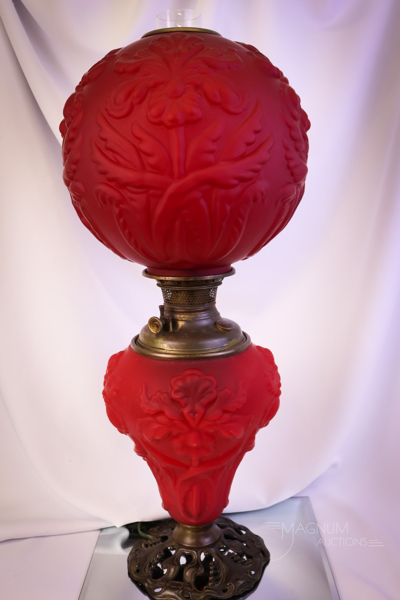 Victorian Pigeon Blood Red Satin Glass Gone with the Wind Parlor Oil Lamp: A super example of a highly collectible Victorian red satin pigeon blood Gone with the Wind parlor oil lamp. This lamp is in the Regal Iris pattern. The lamp measures 27 1/2" tall and 10 1/2" wide. Th