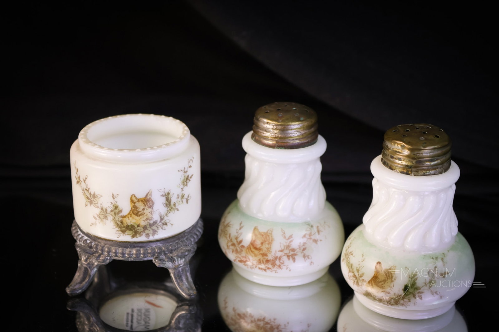 3 pc Cat Themed Victorian Wave Crest Glass Shakers & Toothpick Holder: Three cat-themed articles in Victorian Wave Crest glass. Each is lovingly decorated with a pussy cat. The lot offers a pair of shakers and a toothpick holder. The tallest measures 2 1/2". SHIPPING NOT